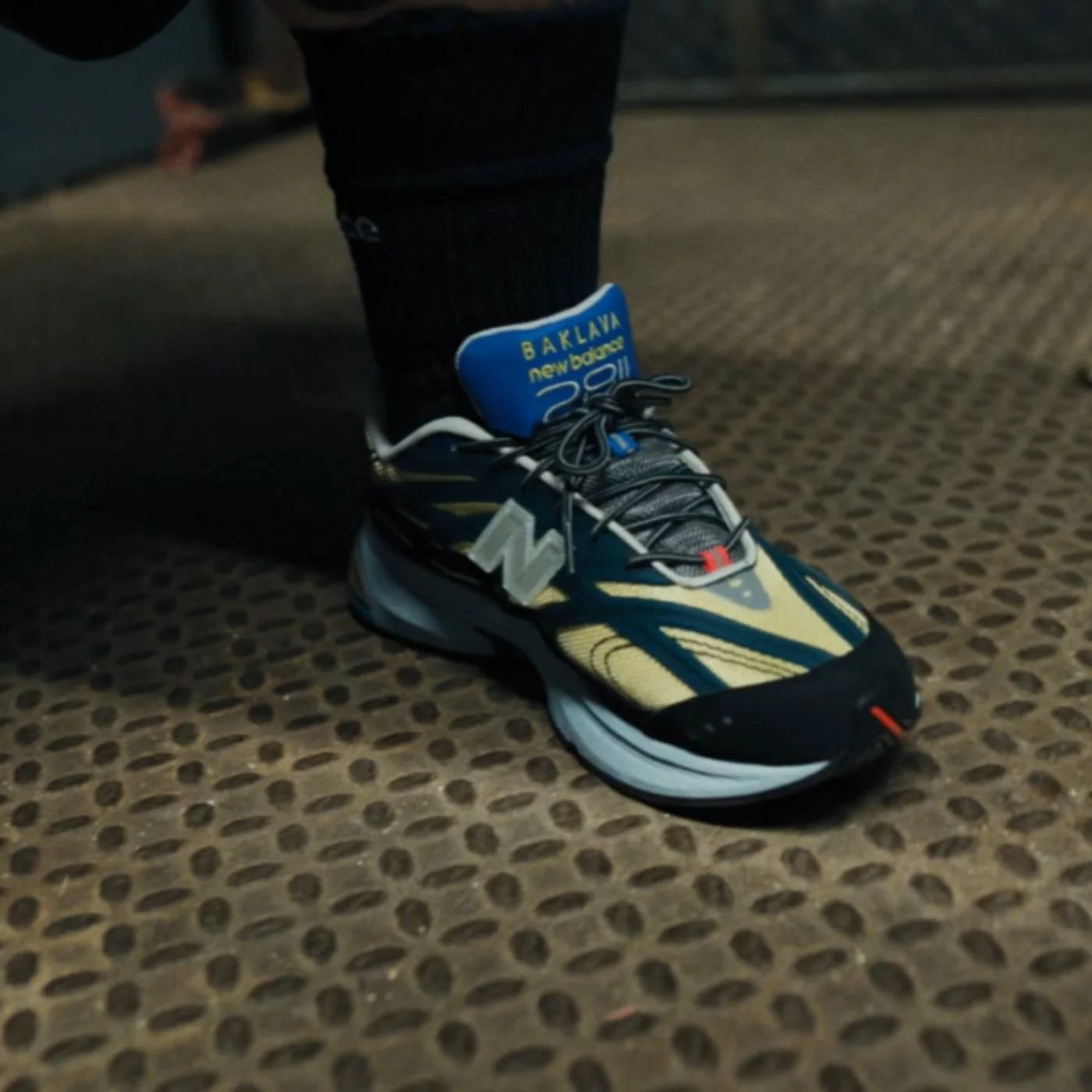 Image of Action Bronson wearing the New Balance 2811 “Mikročpske,” sneaker
