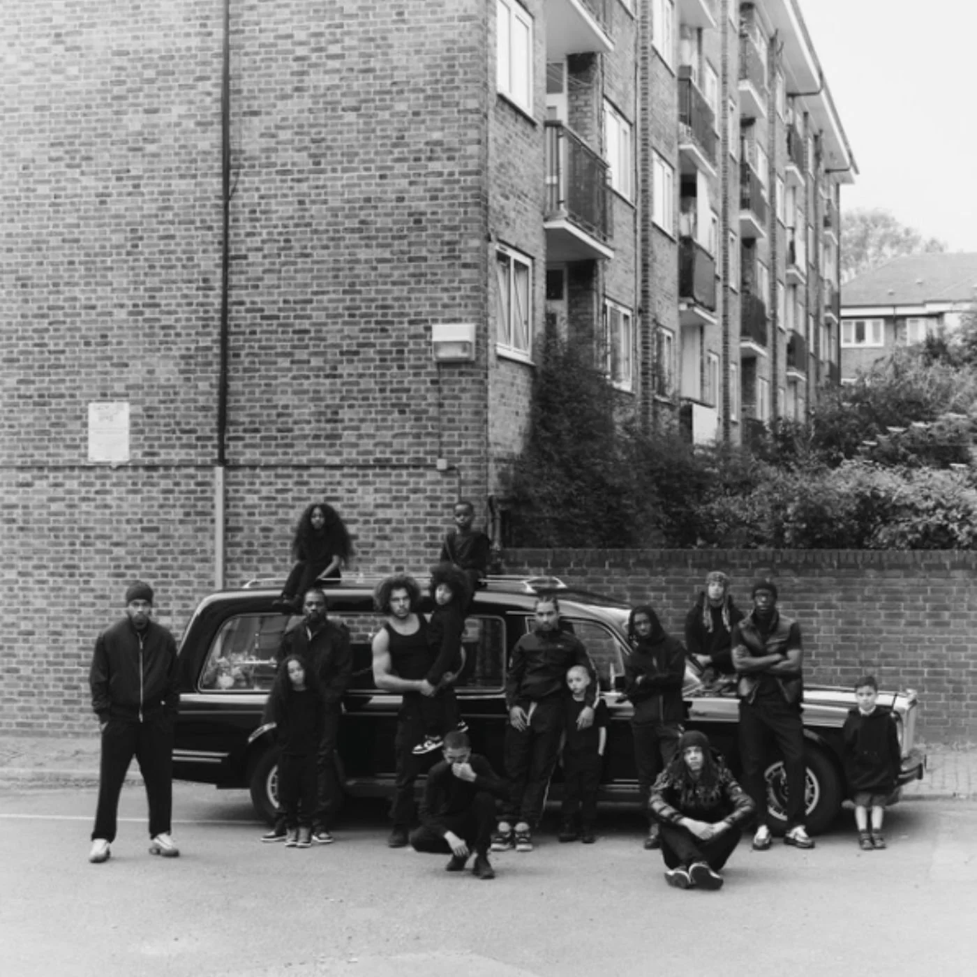 “The End, Never Ends” album cover art featuring a picture of Joe James with his friends in front of a car