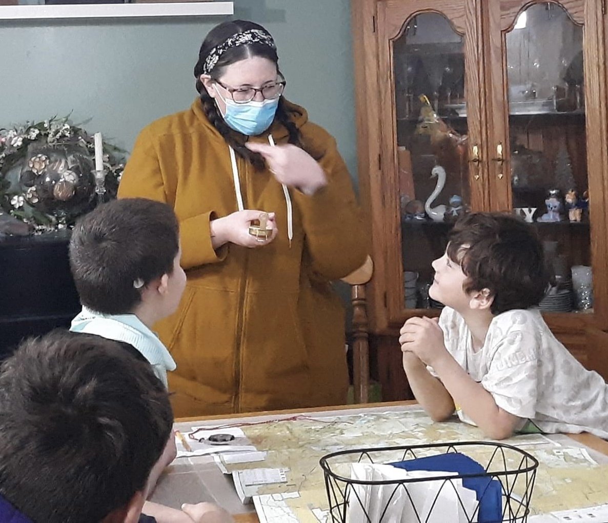 Snowy teaching compass skills to a local Boy Scout Troop in 2021