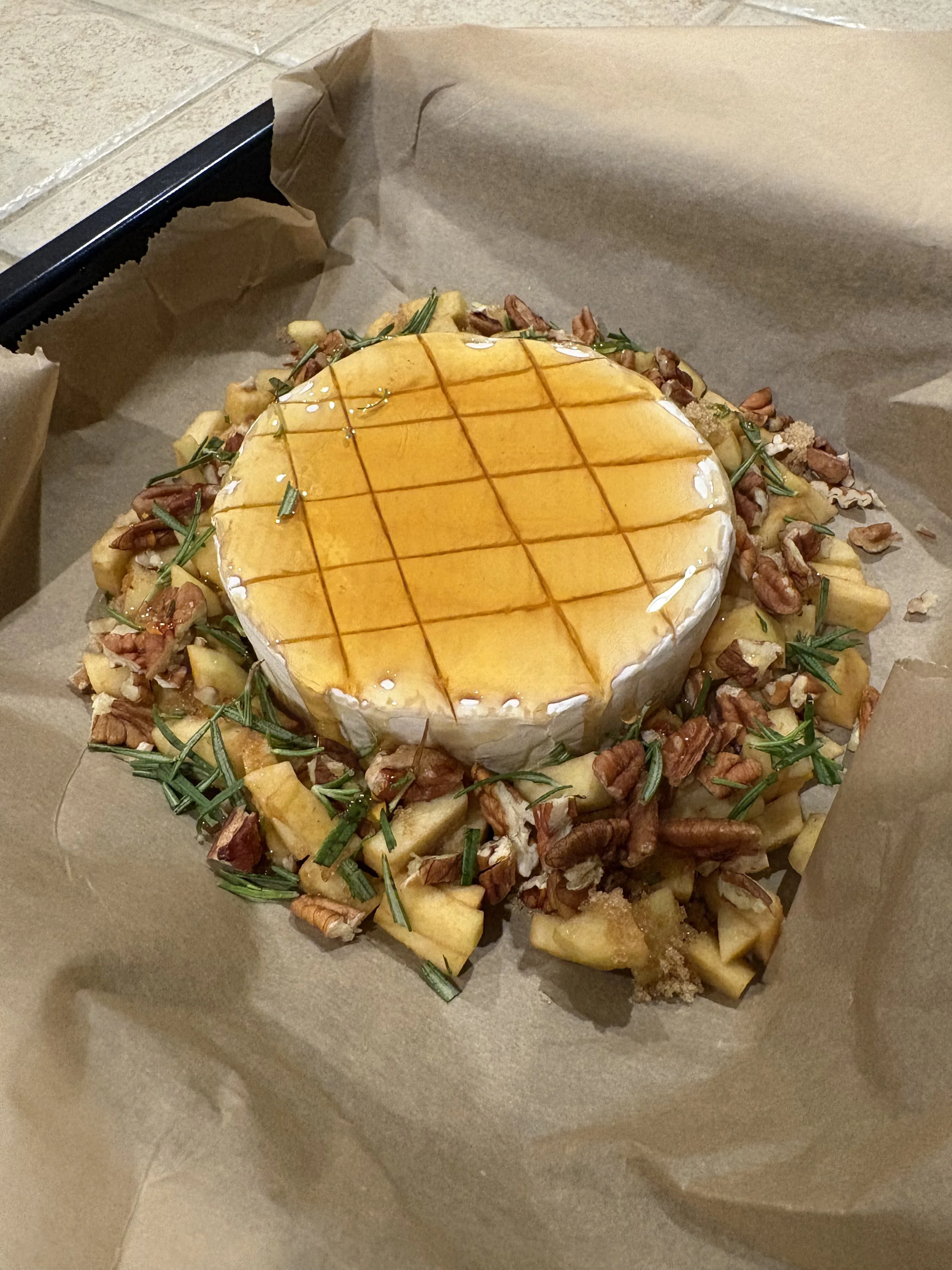 Warm Brie with Honey, Rosemary, Nuts, and Apples