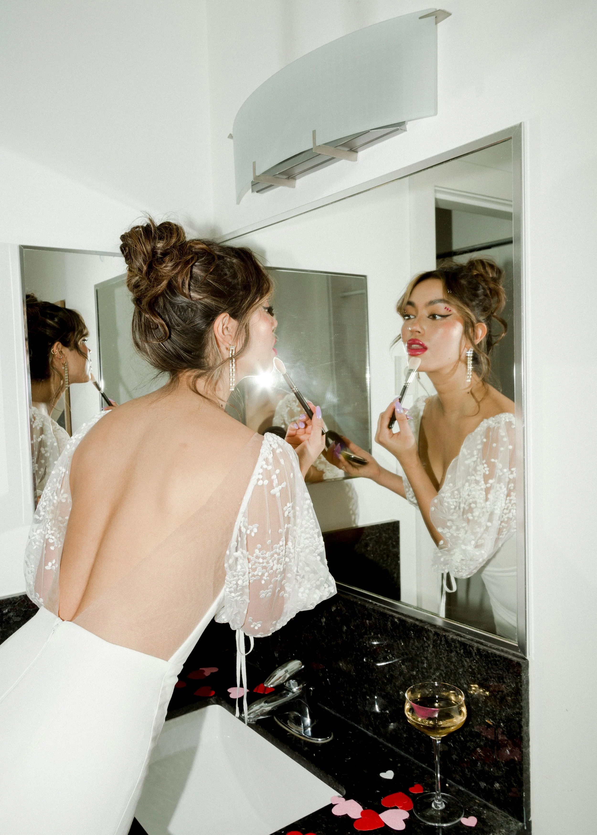 LAUDAE Florence gown with polka dot sleeves and a stunning open back. Fitted crepe bridal gown that is chic and fun.