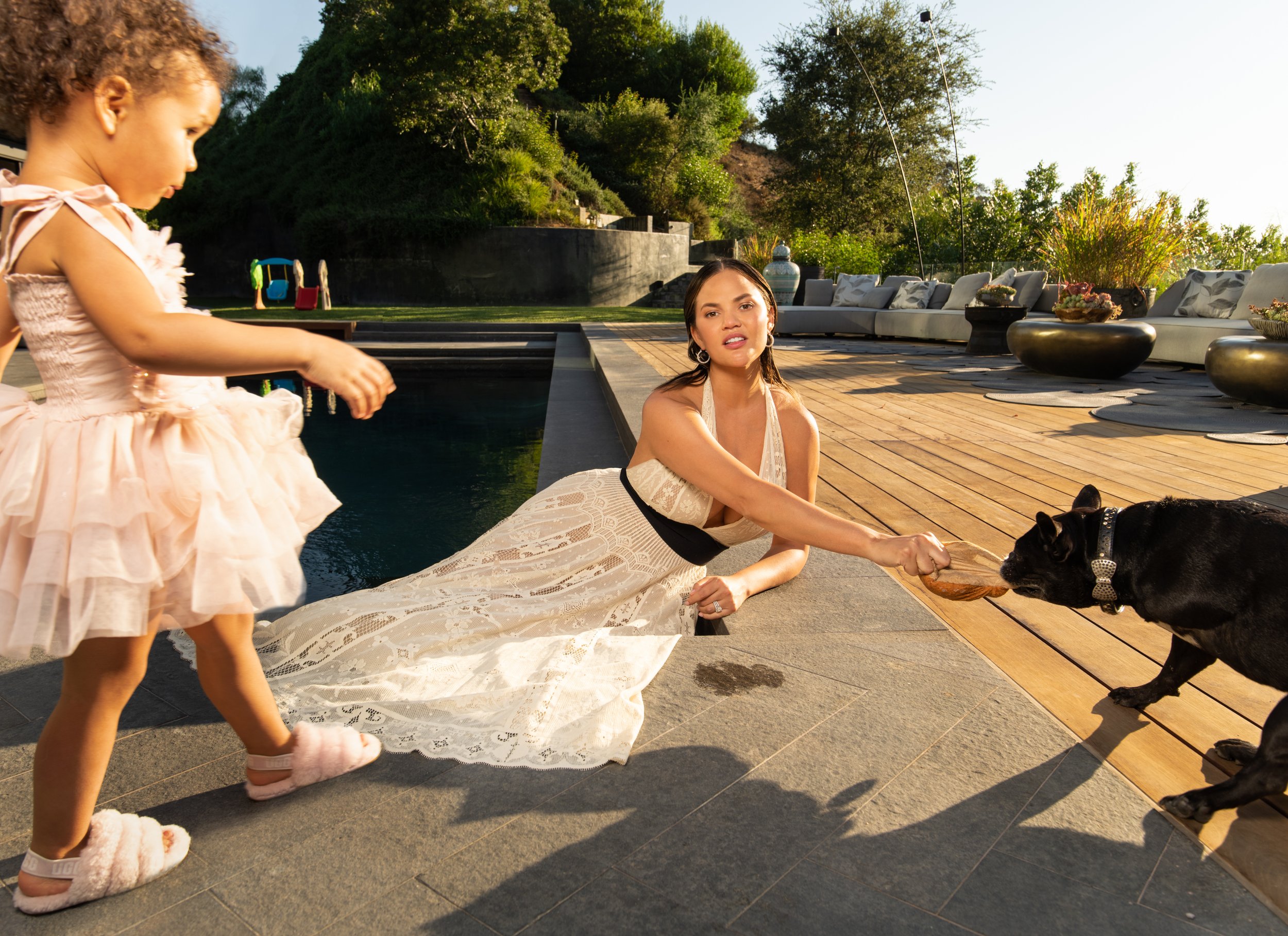 Chrissy Teigen with her daughter Luna, and dog Penny