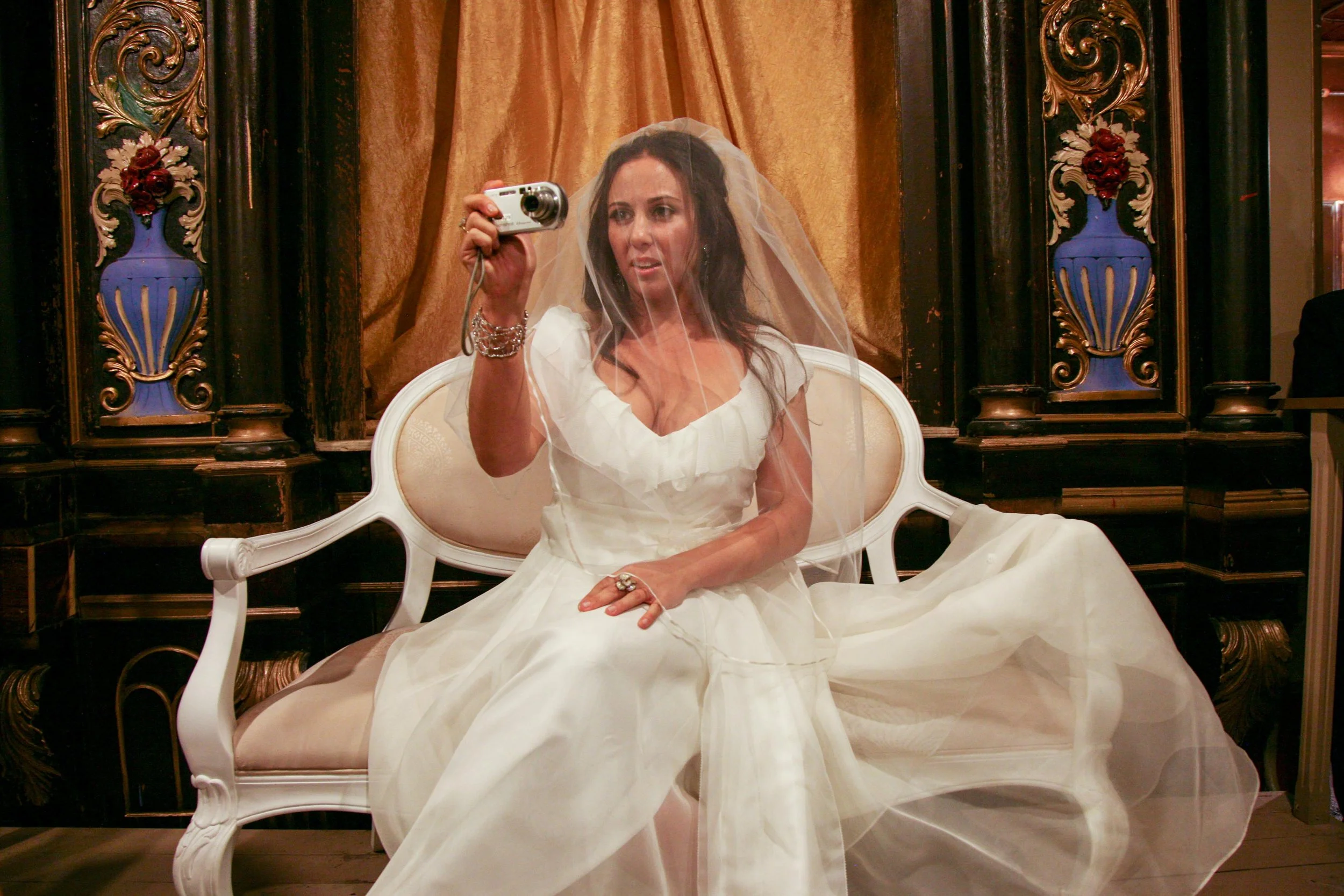 I am way more comfortable behind the camera than in front of it! While I sat awkwardly on a loveseat before my wedding, everyone stood around. I reflexively reached out and grabbed a camera from my friend’s hand and started photographing.