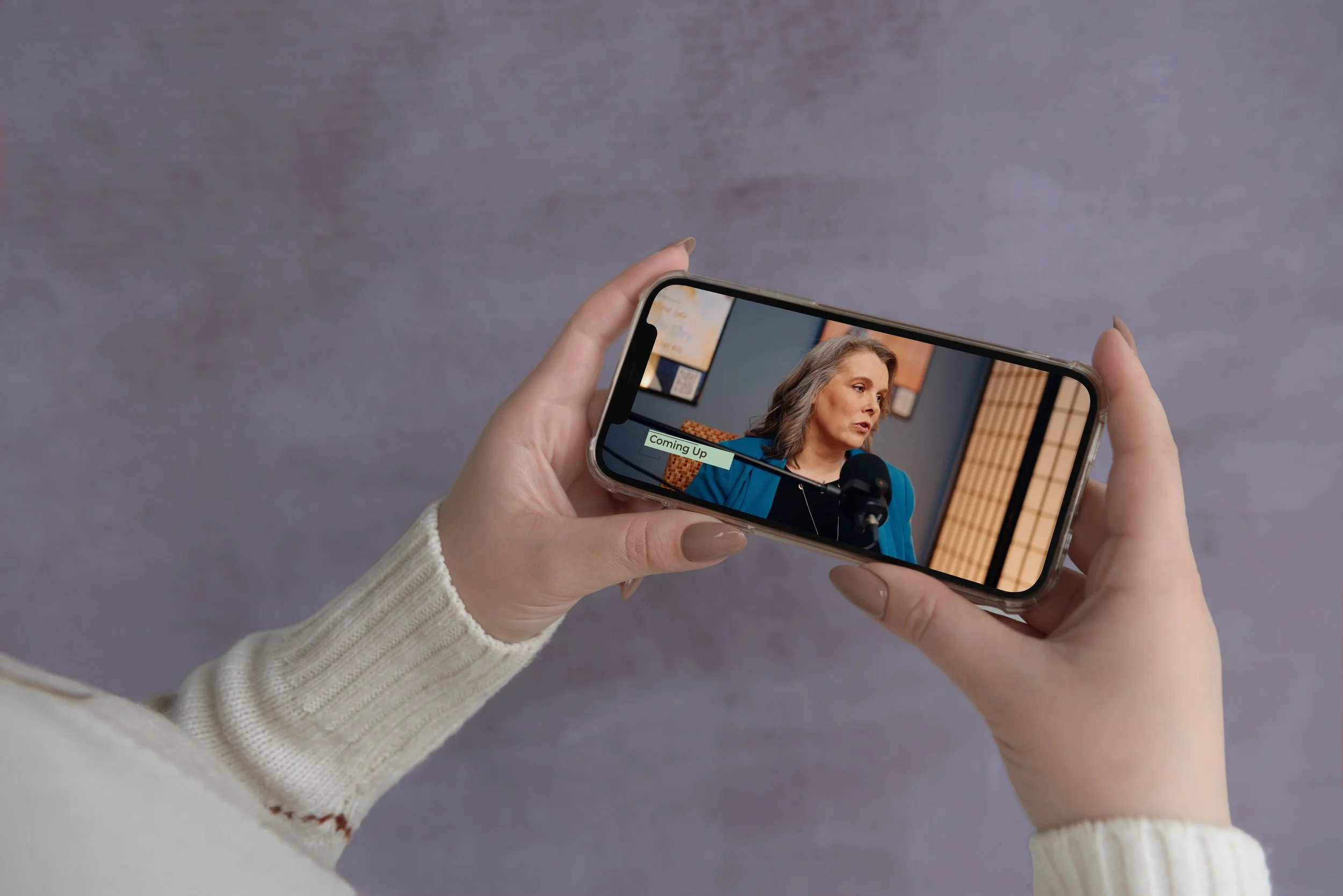 PR-Phone in Womans Hands Horizontal Layout.jpg