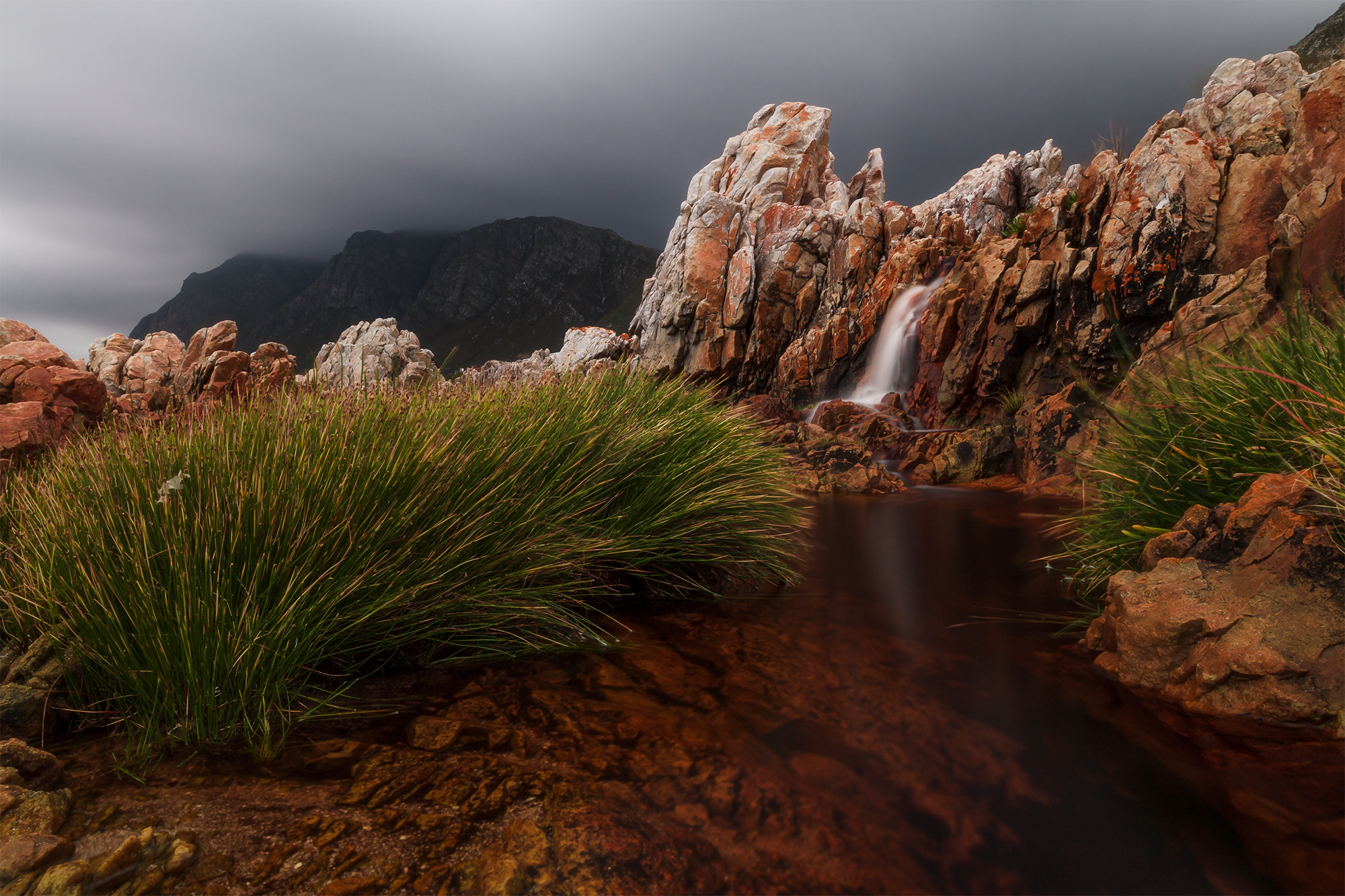 Waterfall Between The Rocks