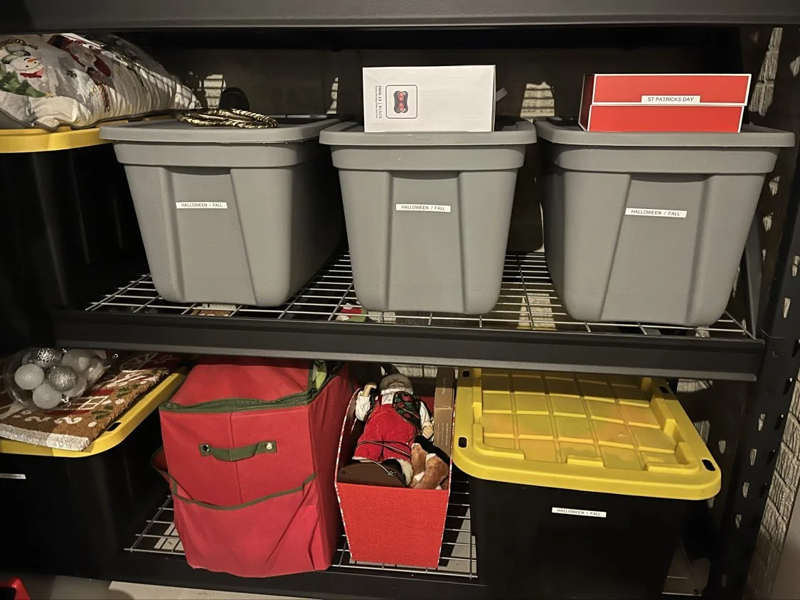 Neatly organized second basement storage room with labeled bins on shelves by Declutter with Devon in Broadview Heights