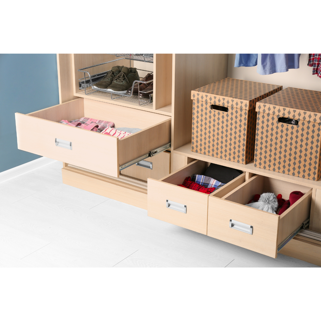 Clothing stored in several open drawers