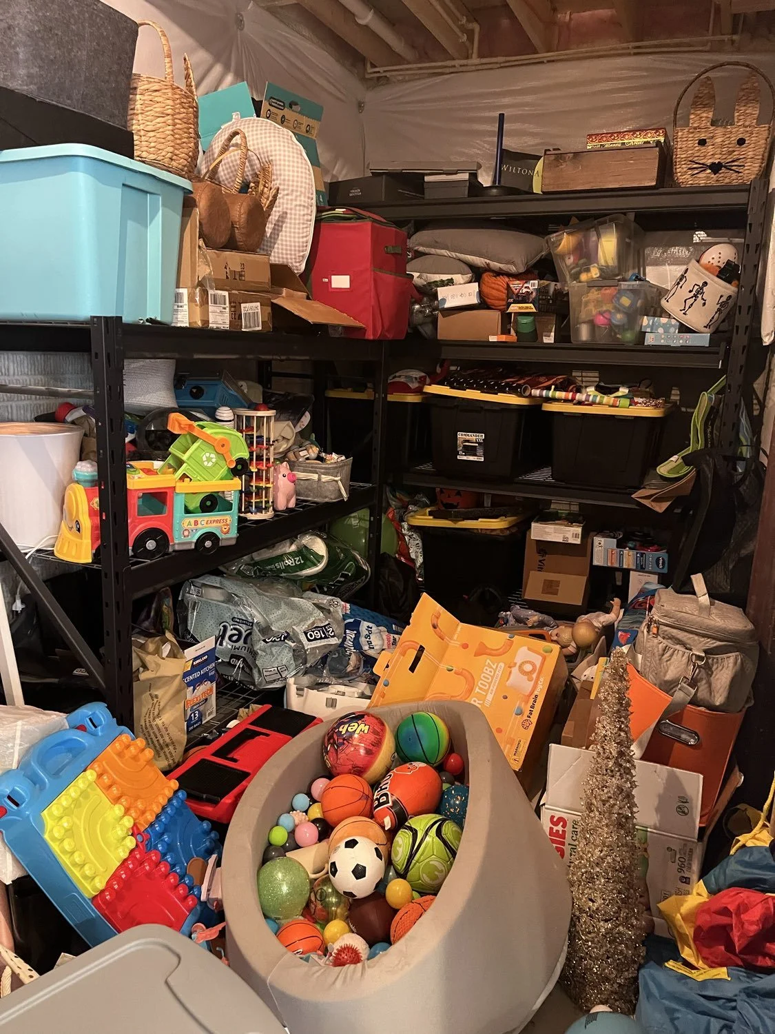 Cluttered basement storage room before professional organizing in Broadview Heights, Ohio