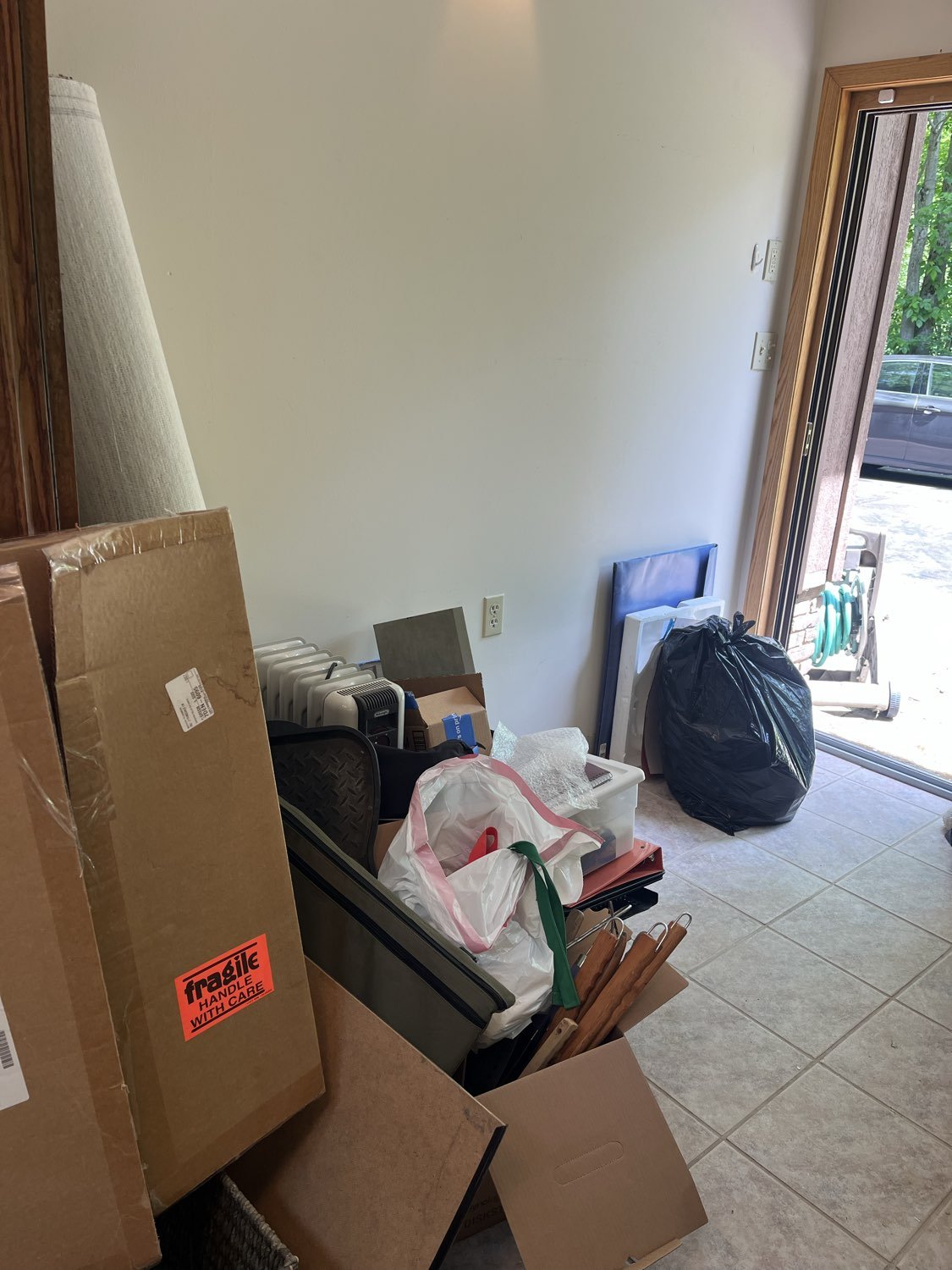 Piles of clutter and trash in the art studio in Moreland Hills, Ohio before decluttering