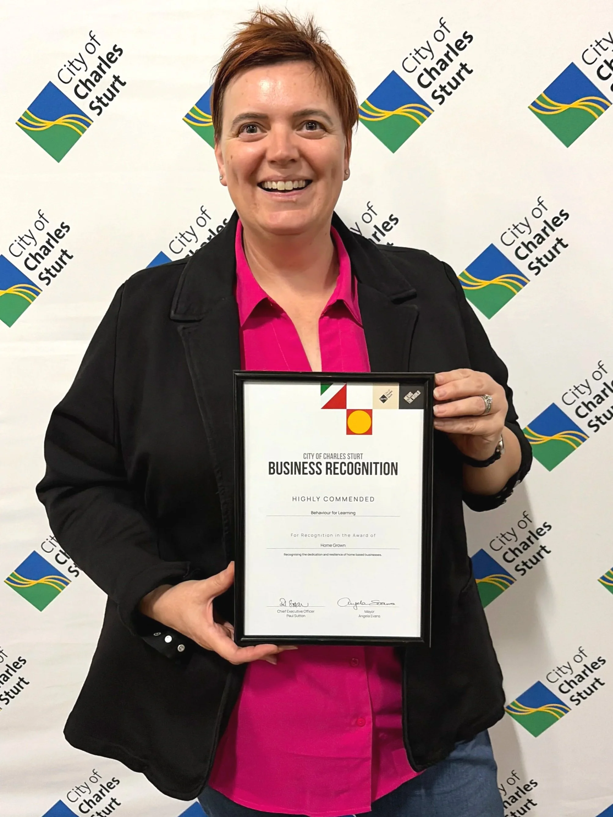 Roisin from Behaviour for Learning holding Business recognition highly commended certificate from City of Charles Sturt