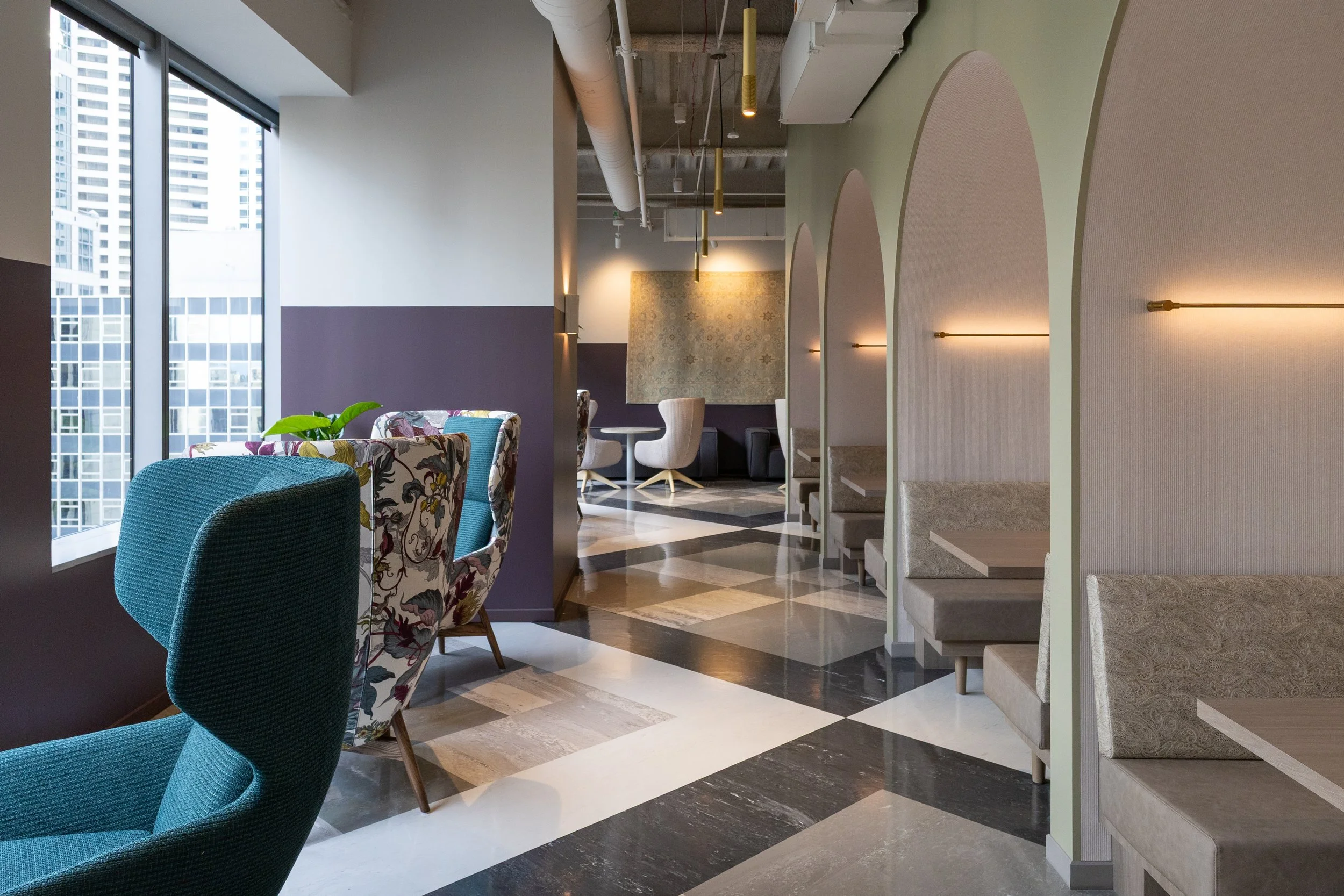 Custom furniture and dining nooks in blue, purple, gray, and light green tones. Modern office in Seattle, Washington