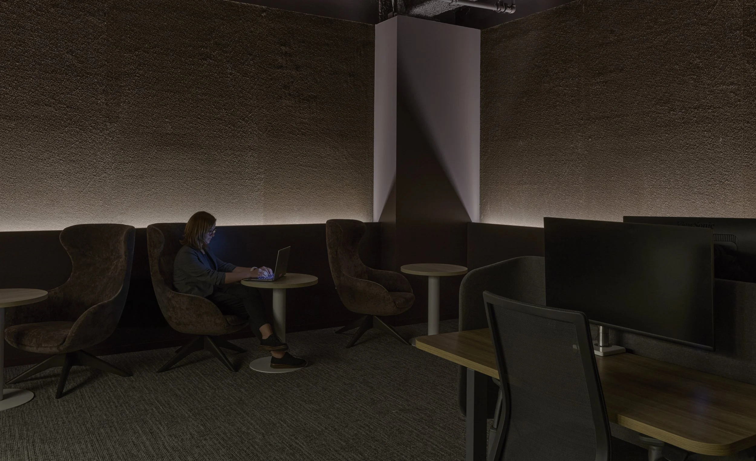 Dark workspace that caters to those who like to work in dark spaces with custom low lighting.