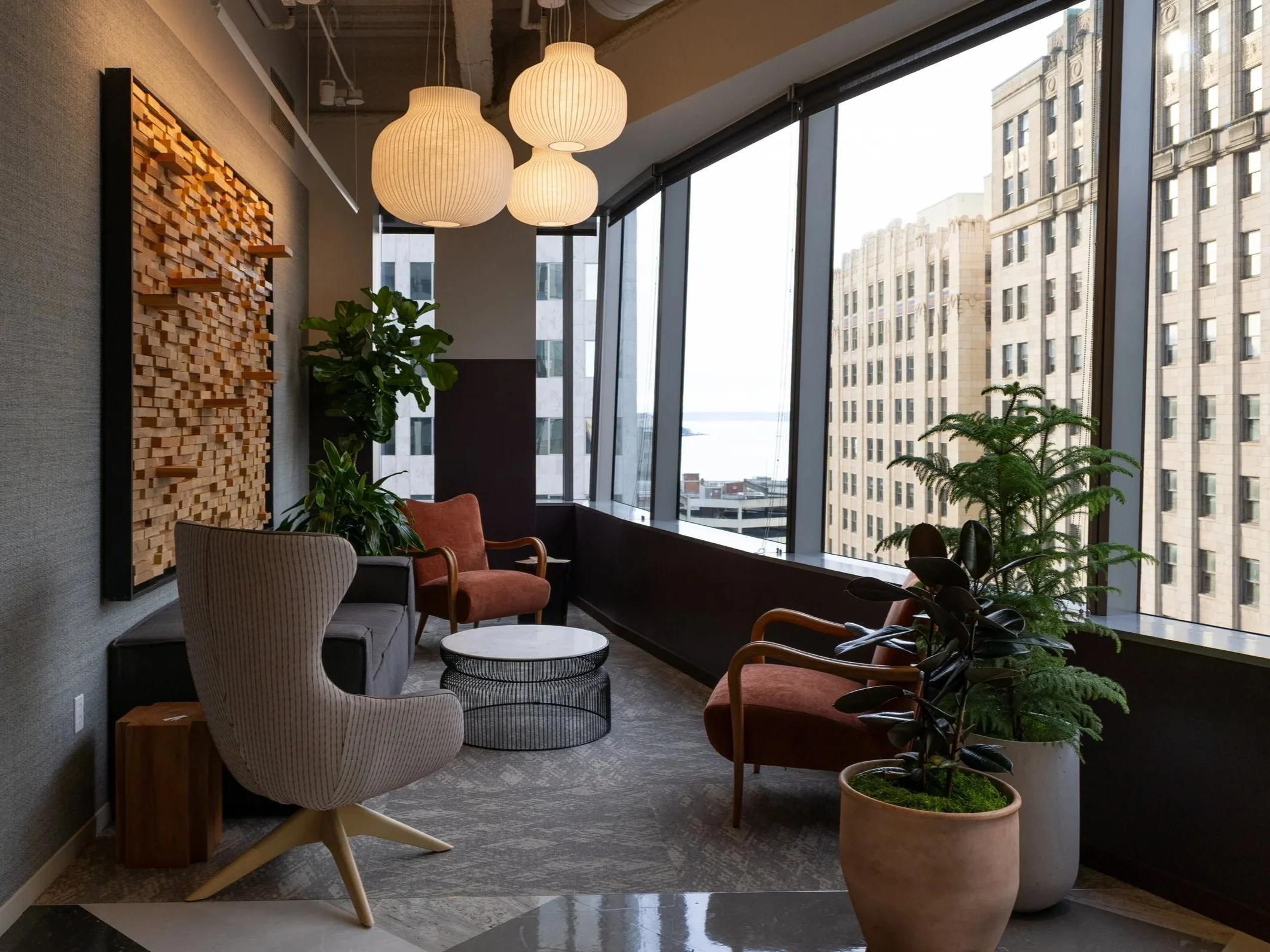 Seattle Office Design featuring custom chairs, custom lighting, artwork and biophilia