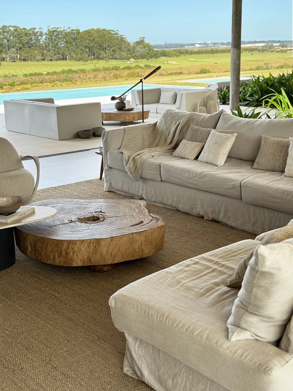 Luxury villa living room at Fasano Las Piedras, Punta del Este, featuring contemporary interior design, natural materials and bespoke furnishings by MIA Studio.