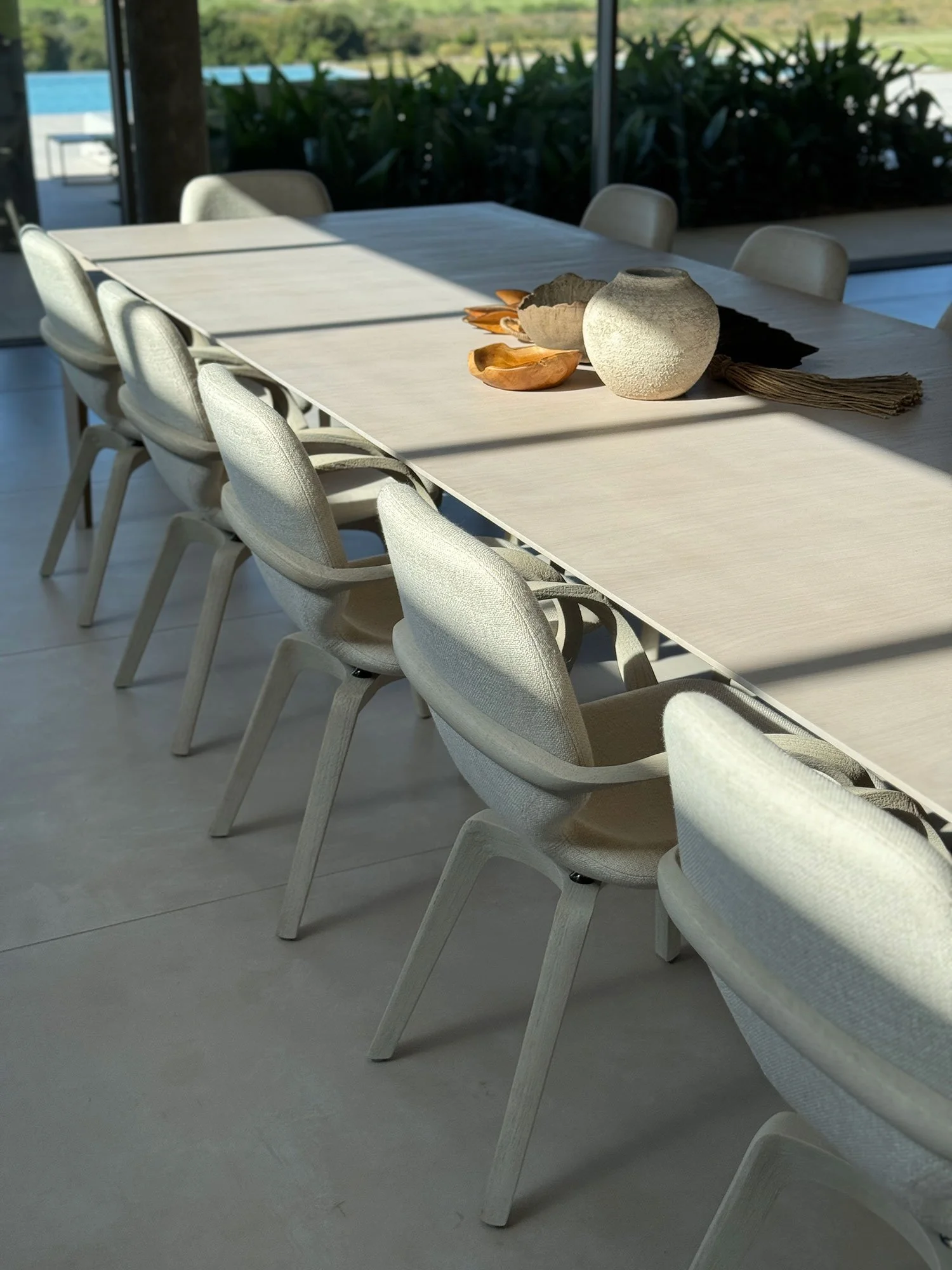 Luxury villa dining room at Fasano Las Piedras, Punta del Este, featuring contemporary residential interior design and bespoke furnishings by MIA Studio.