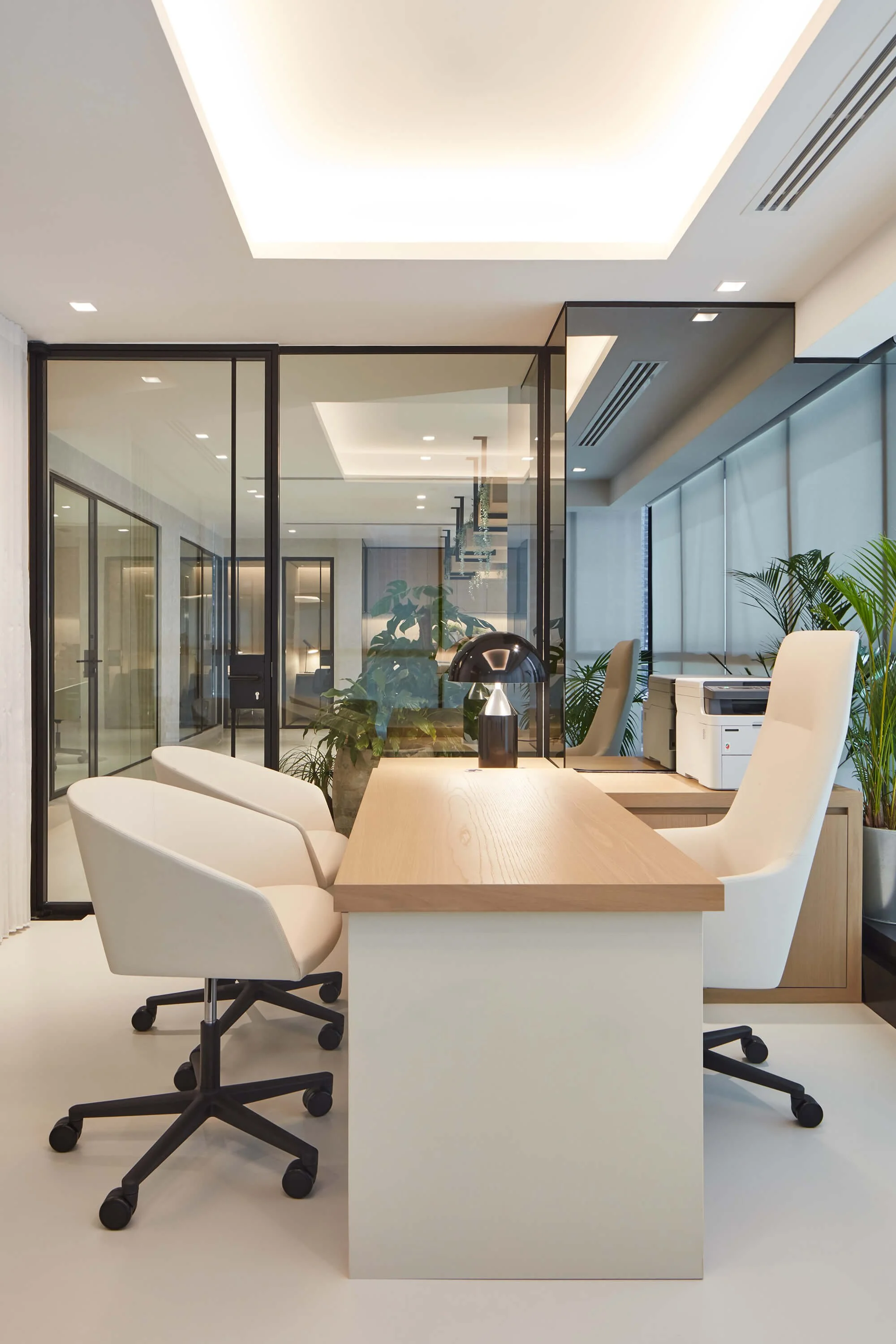Luxury workplace interior combining hospitality-inspired design, bespoke joinery and contemporary furniture by MIA Studio.