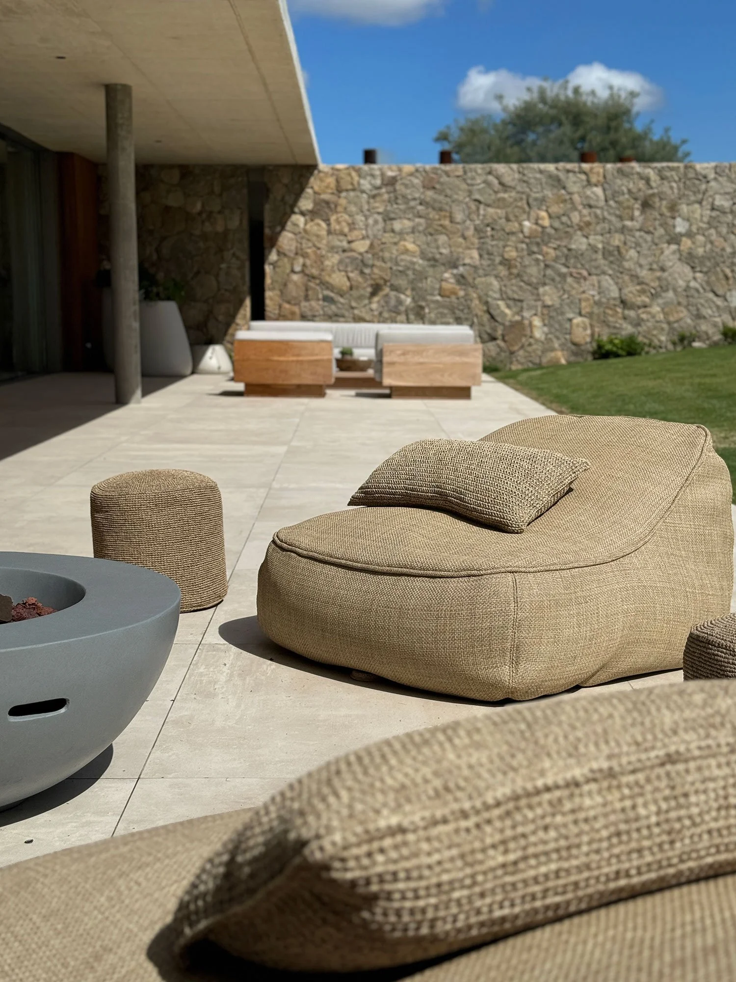 Outdoor living area at Fasano Las Piedras, Punta del Este, seamlessly connecting the villa with the surrounding landscape through contemporary residential design by MIA Studio.