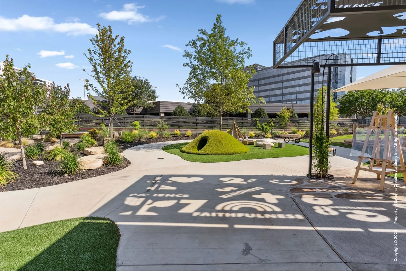Outdoor play area designed to encourage exploration and connection with nature by MIA Studio.