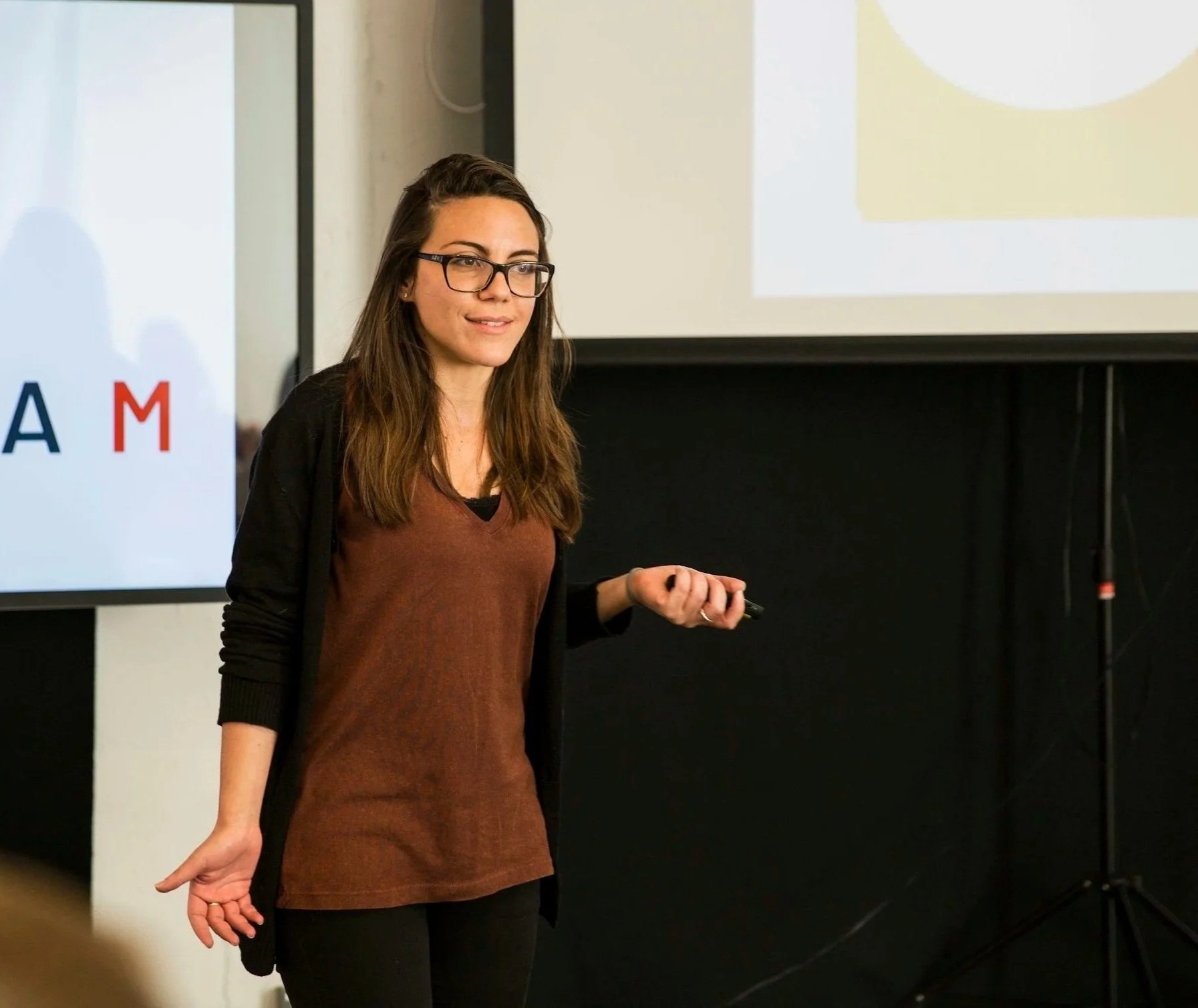 A female Founder giving her pitch.