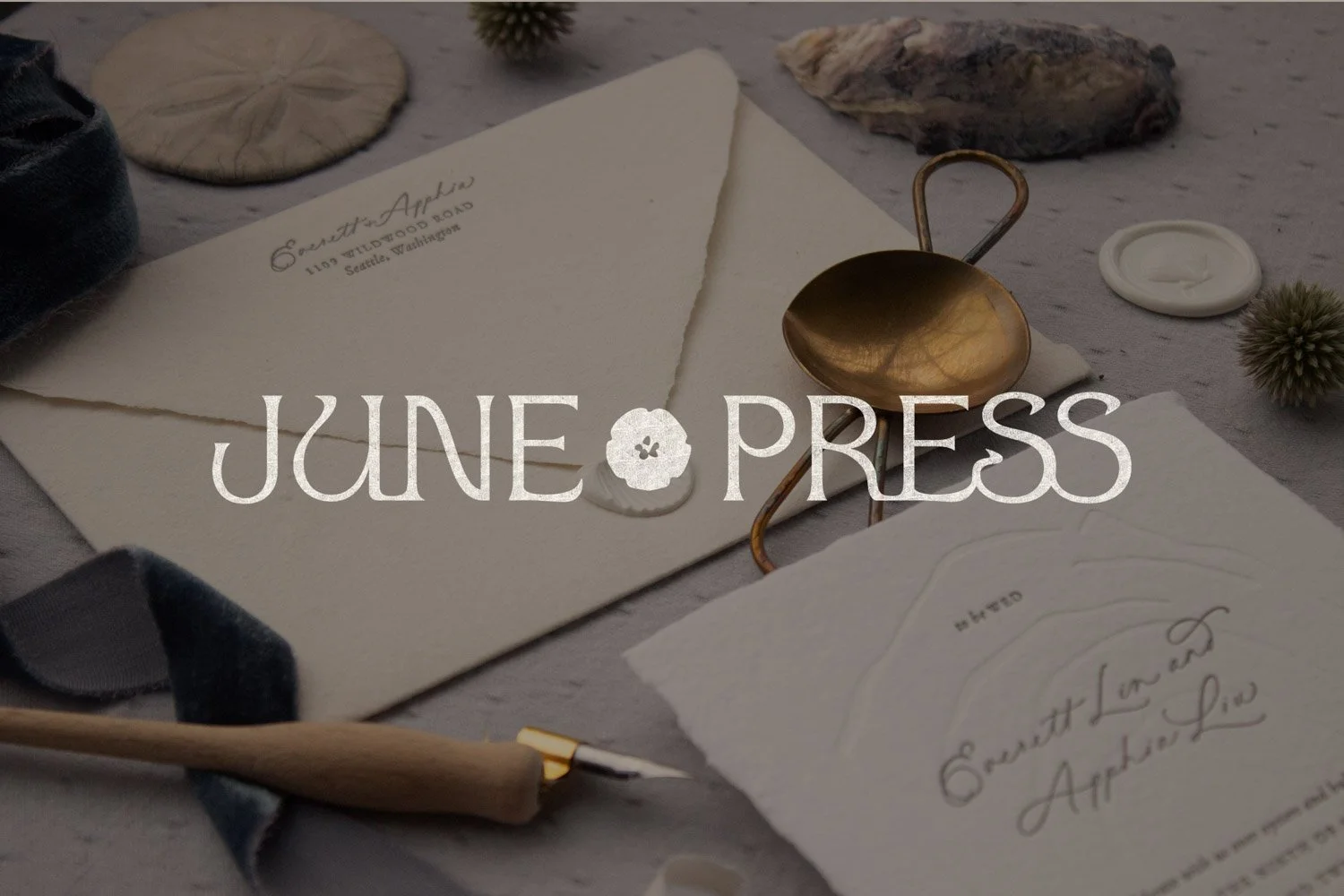 Brand identity showcasing June Press stationery with textured paper goods, coastal botanical motifs, and elegant typography