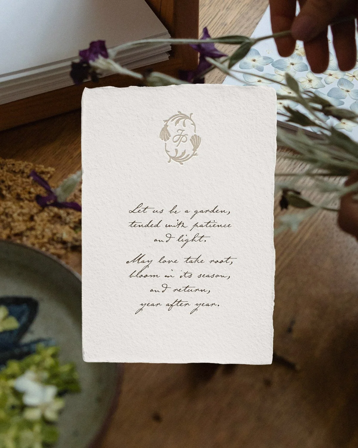 Handmade stationery design for June Press featuring deckled edge paper, embossed monogram, and elegant calligraphy on textured artisan paper