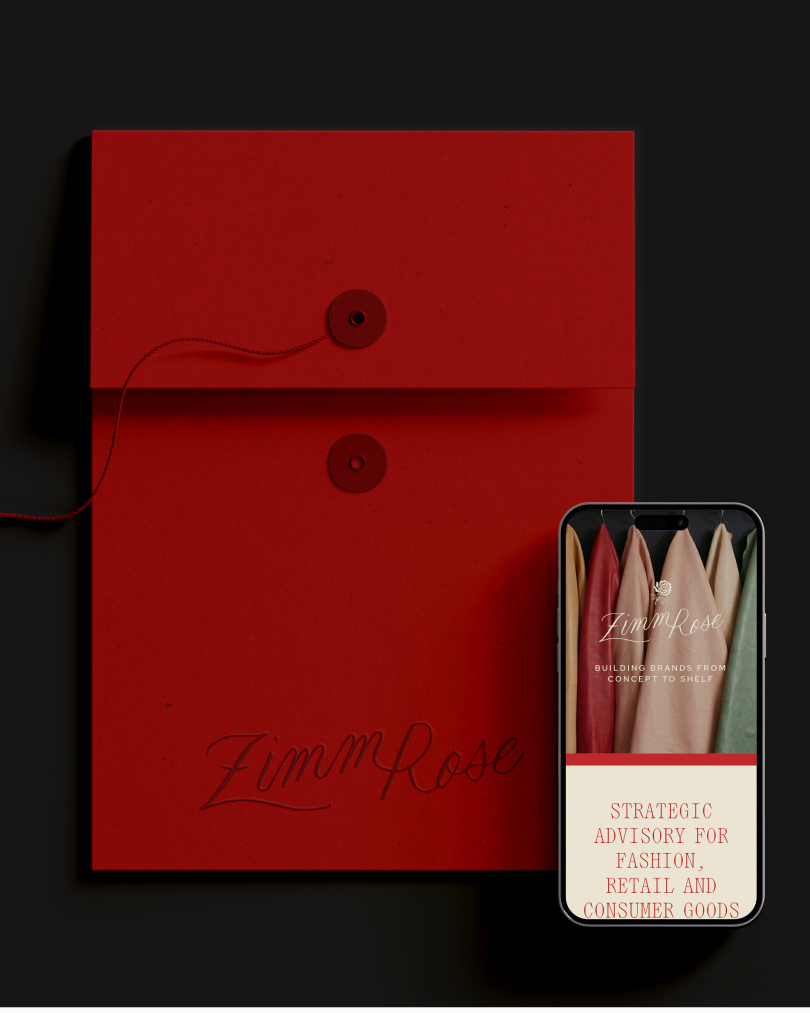 A red envelope-style folder with string closure beside a smartphone displaying the ZimmRose website, showing hanging fabric samples and messaging about strategic advisory services for fashion, retail, and consumer goods.