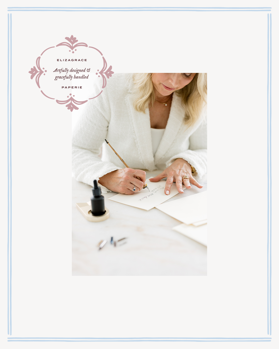 A person in a white textured jacket writes with a dip pen at a table, with ink bottles nearby and an ElizaGrace Paperie emblem in the corner.