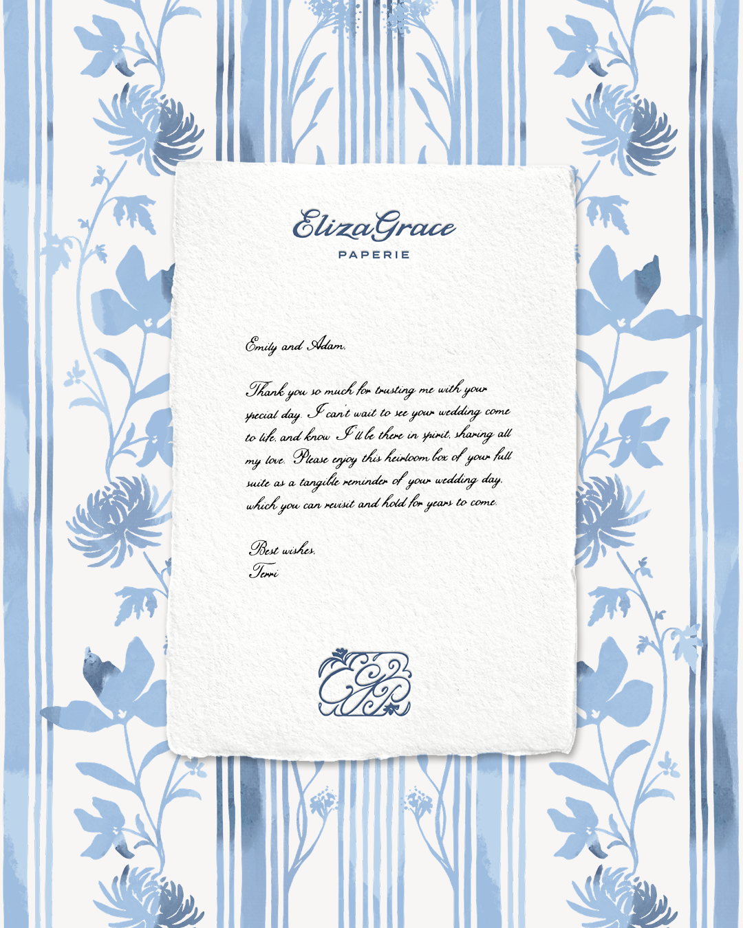 A printed letter on textured paper featuring the “Eliza Grace Paperie” logo at the top, placed on a blue-and-white floral patterned background. The letter includes a heartfelt message expressing gratitude and well wishes.
