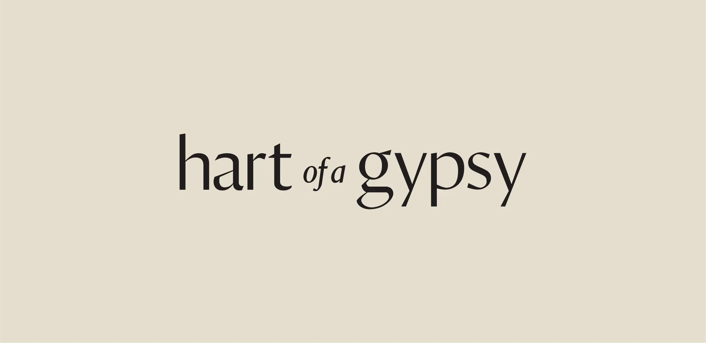 Minimalist beige background with serif text reading “hart of a gypsy,” styled as a simple brand wordmark.