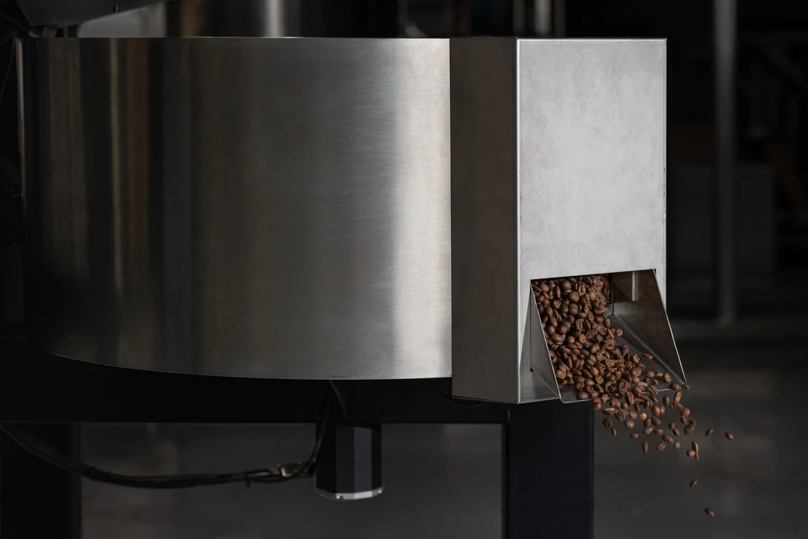 Roasted coffee beans discharging from the NORDRE EMBLA roaster