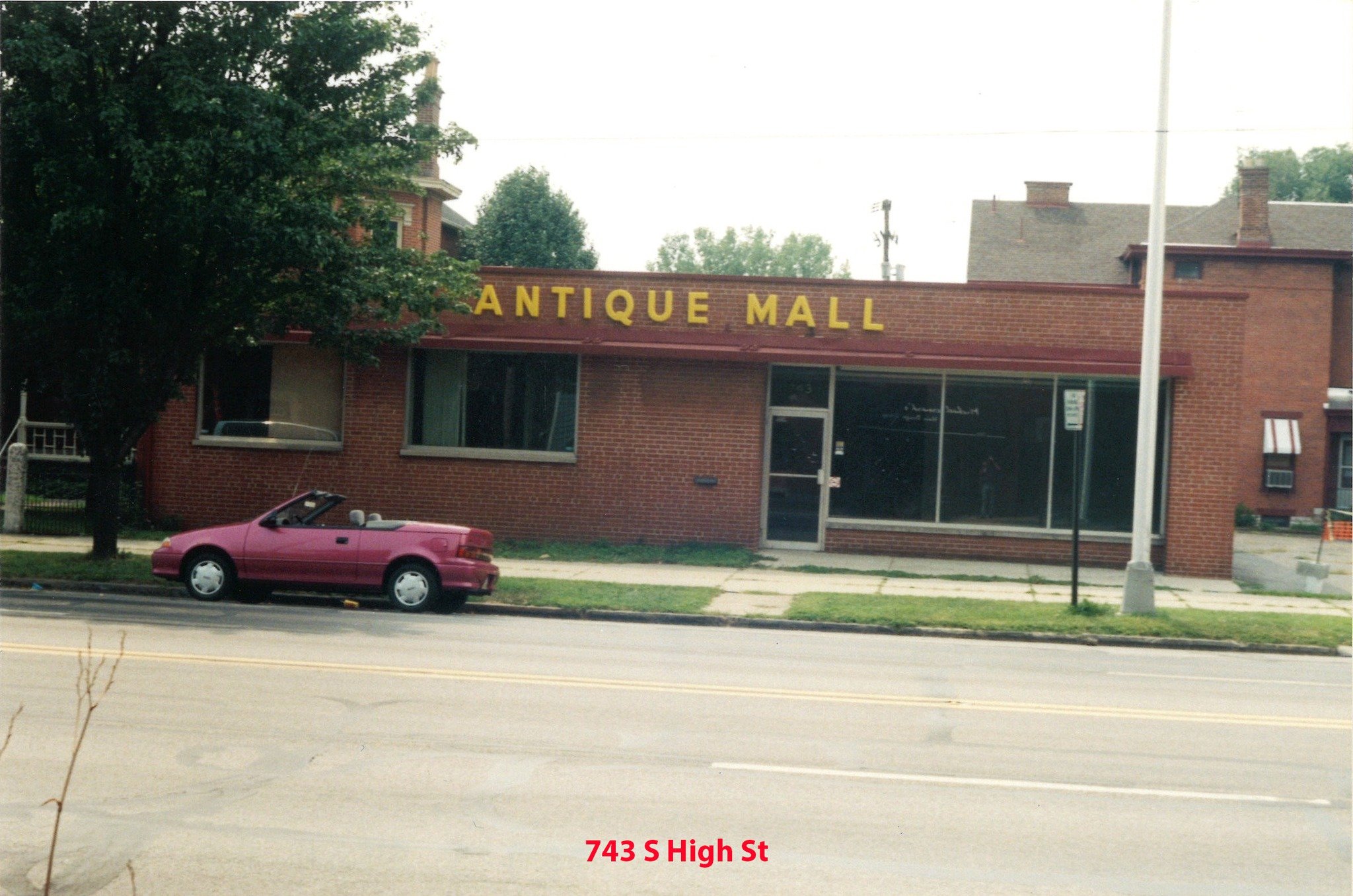 743 South High Street in Columbus, Ohio as an antique mall in 1996, showing a brick storefront with vintage signage and parked car