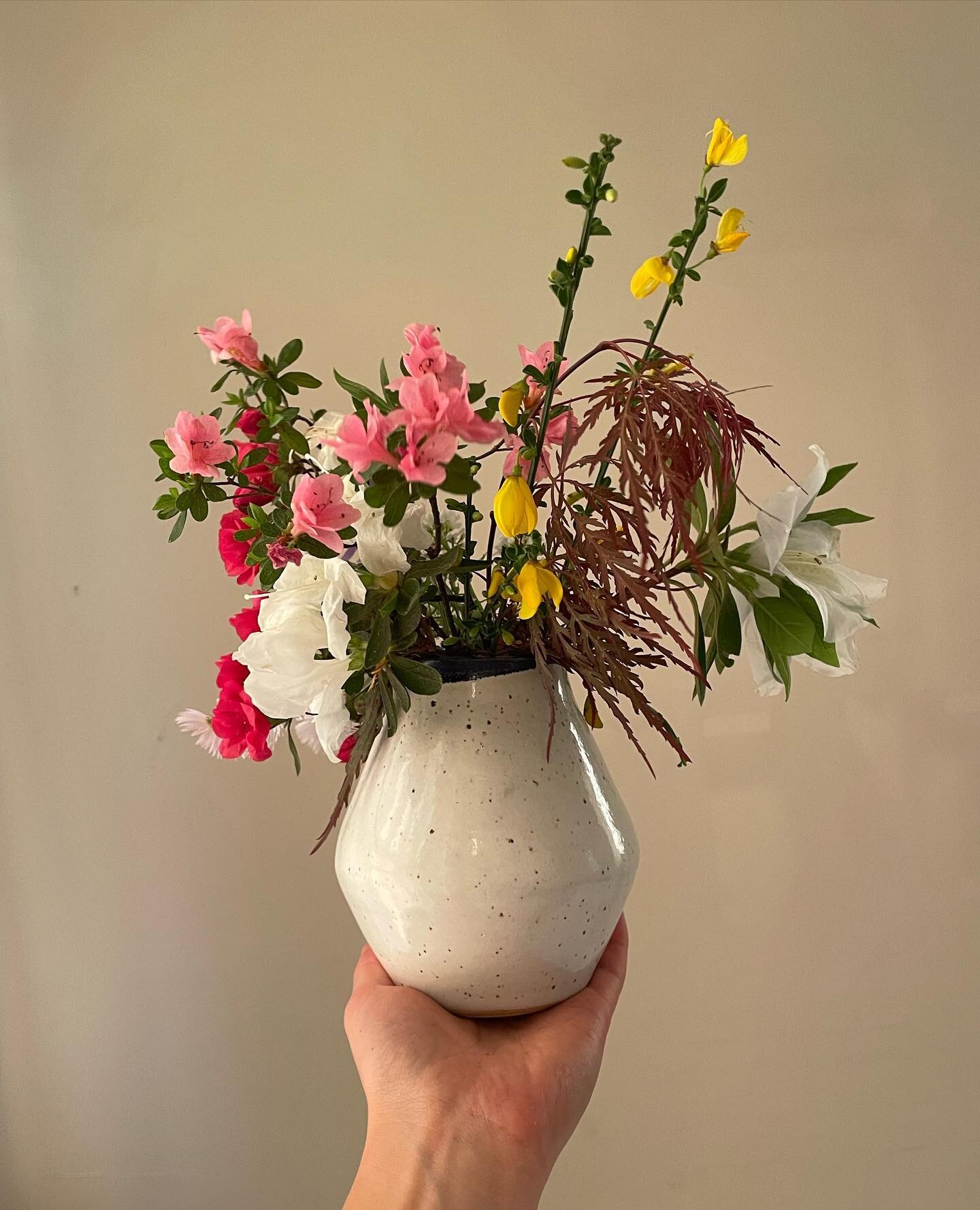 Stray flower bouquet in a vase from ceramics class with the sister