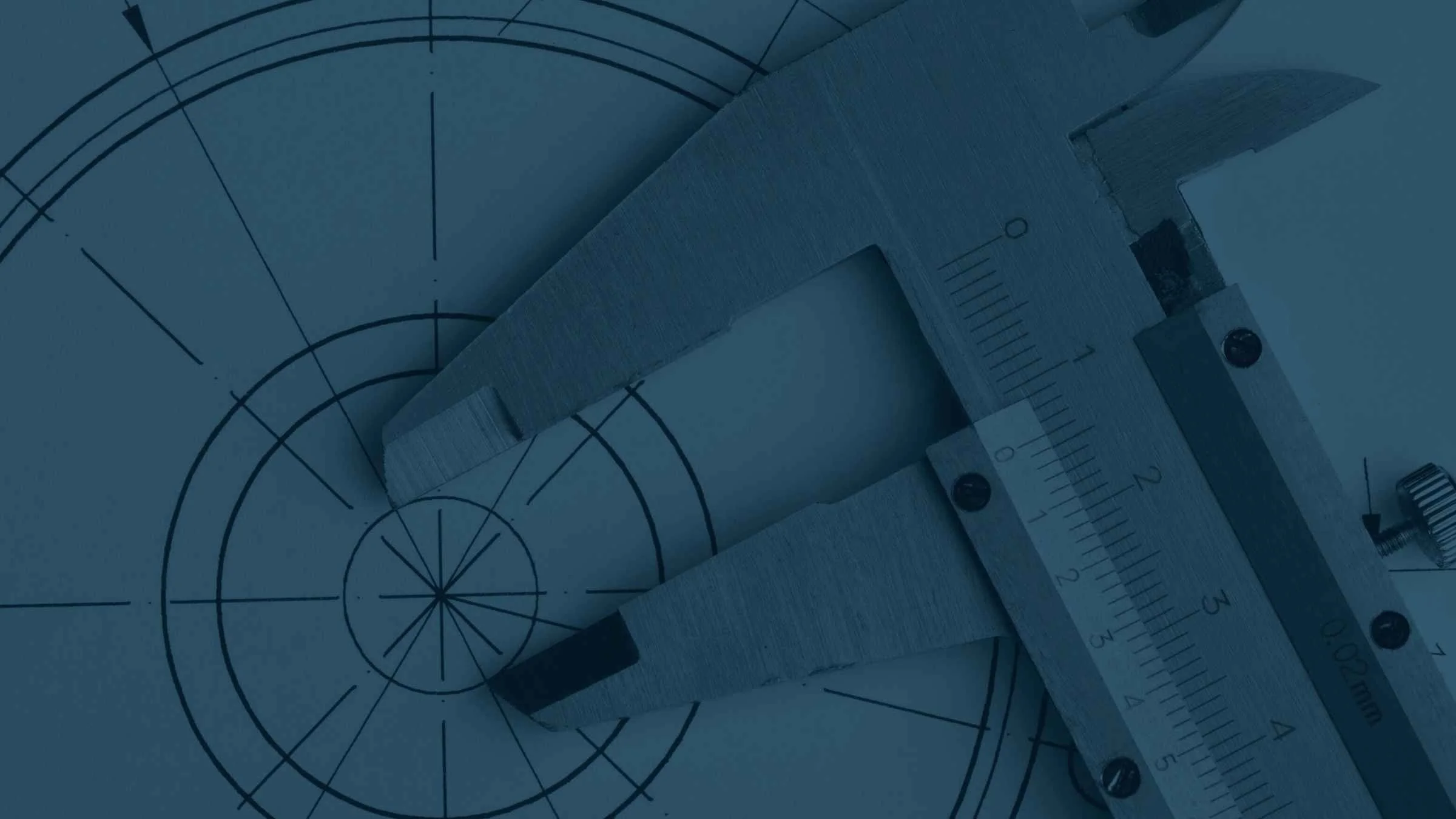 Pair of calipers measuring a circle on a piece of paper.