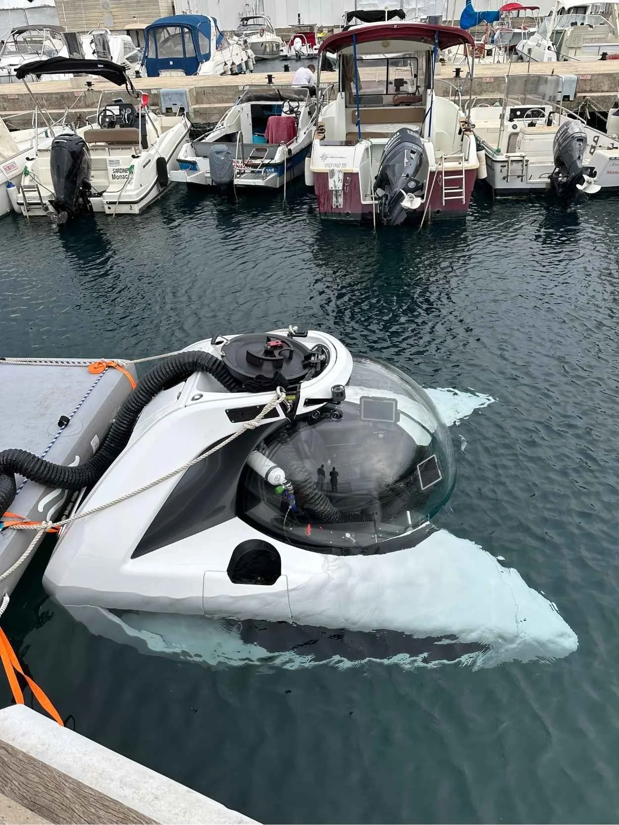 Underwater vessel with a large circular porthole.