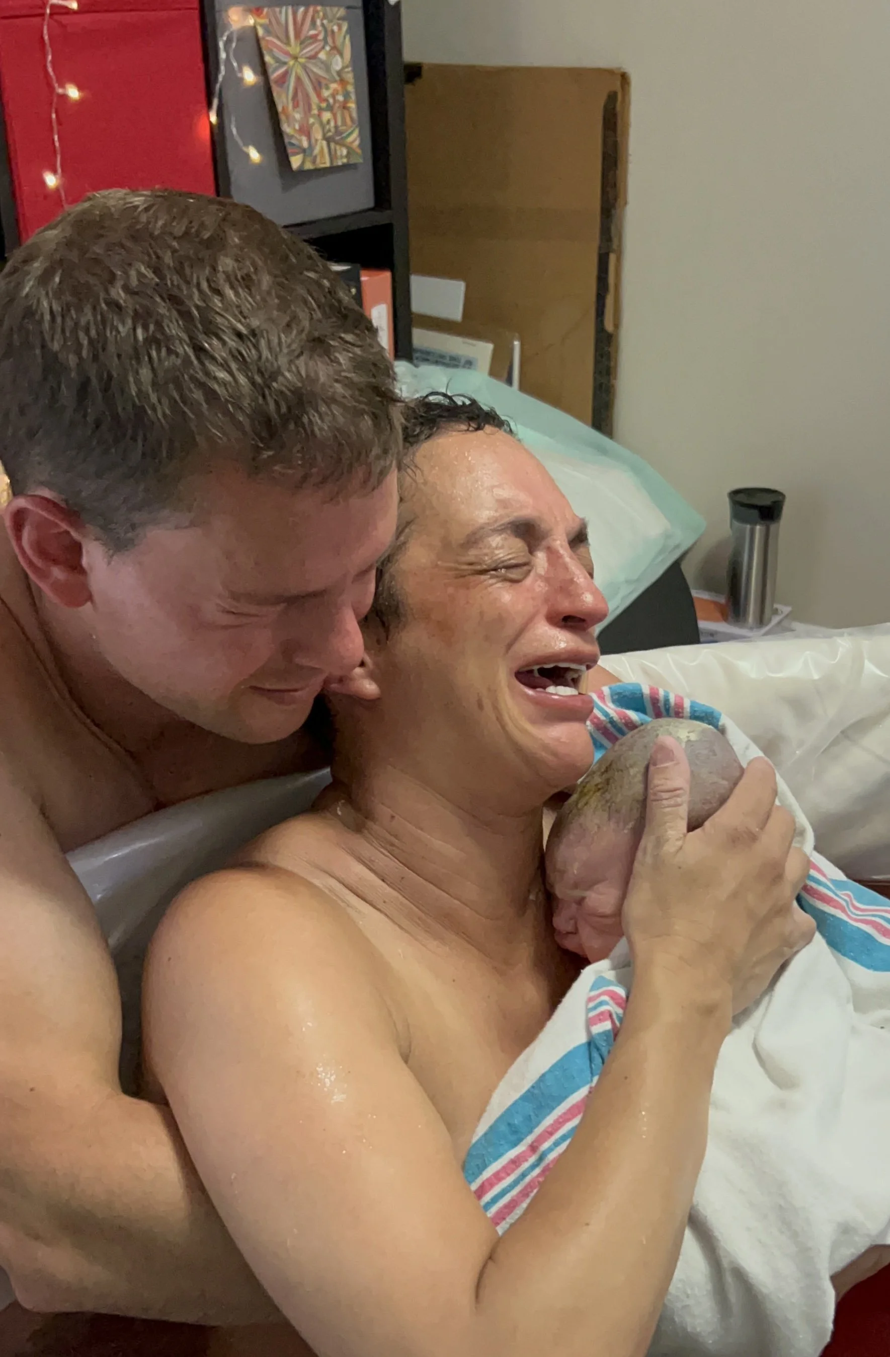 all of the emotions of love, relief and joy when baby is born. home water birth