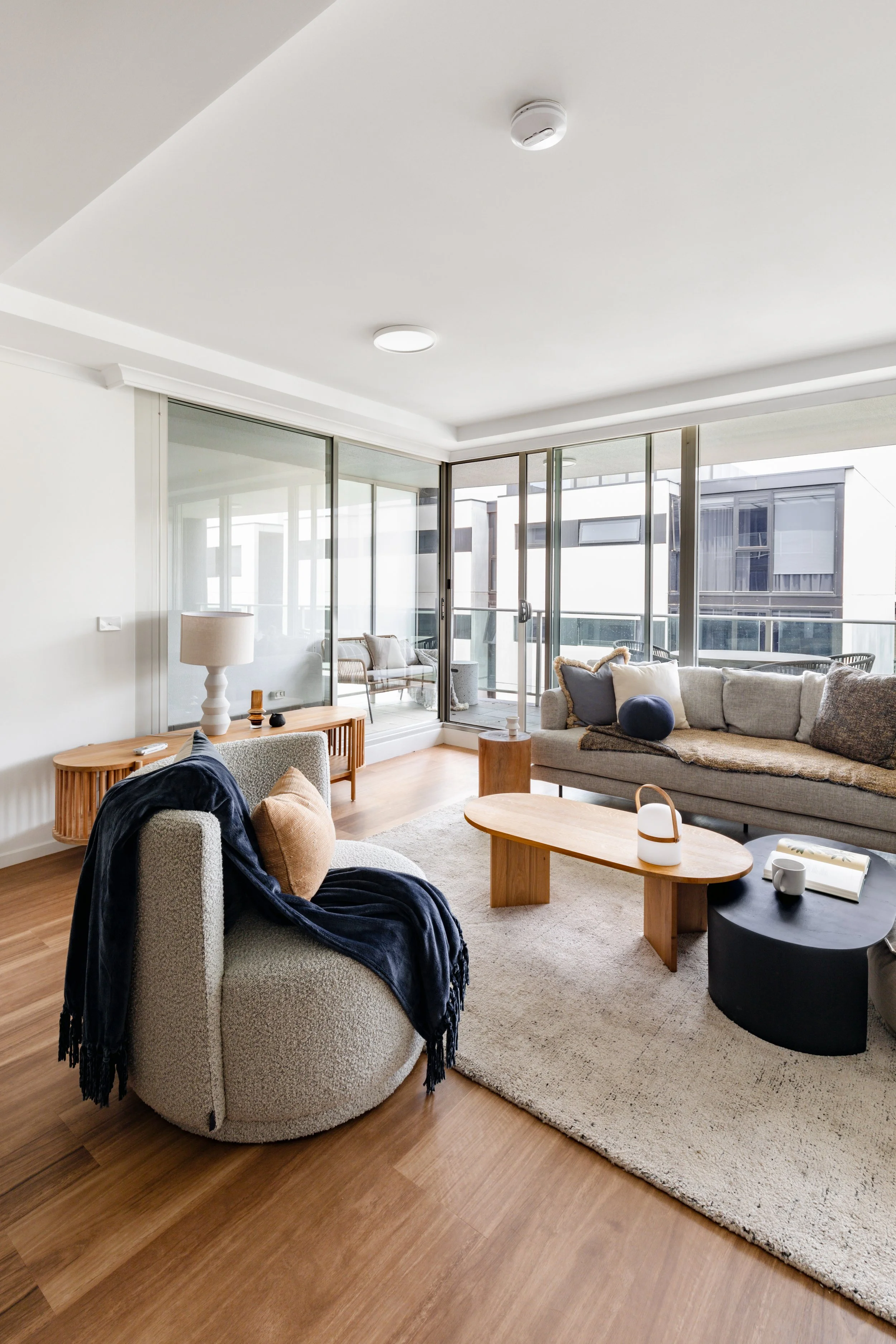 Cento living space showing lots of space, light, big windows with timber floors