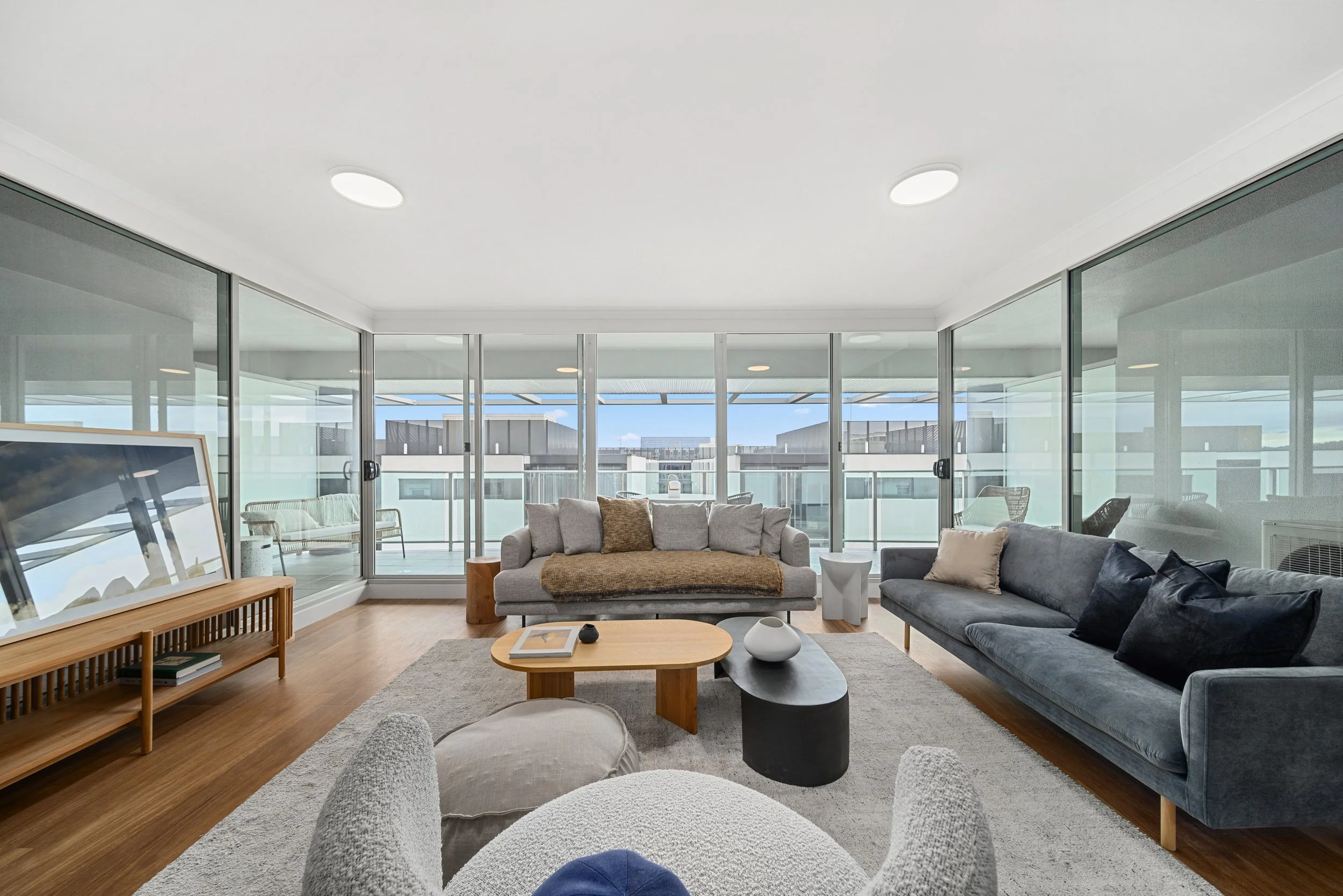 Cento living space showing lots of space, light, big windows with timber floors