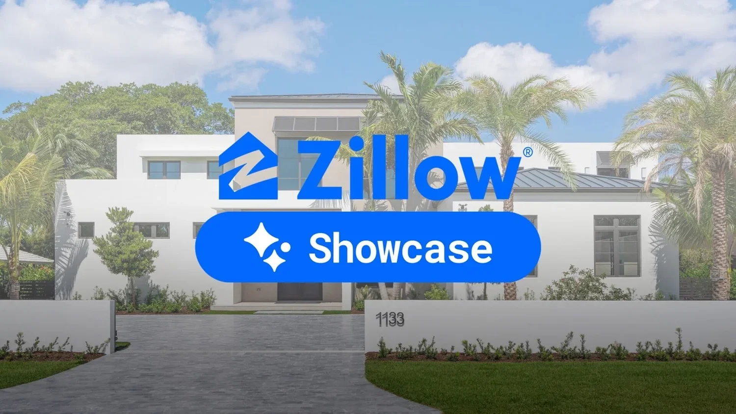 A modern white house with palm trees in front, showing the Zillow Showcase logo overlayed on the image.