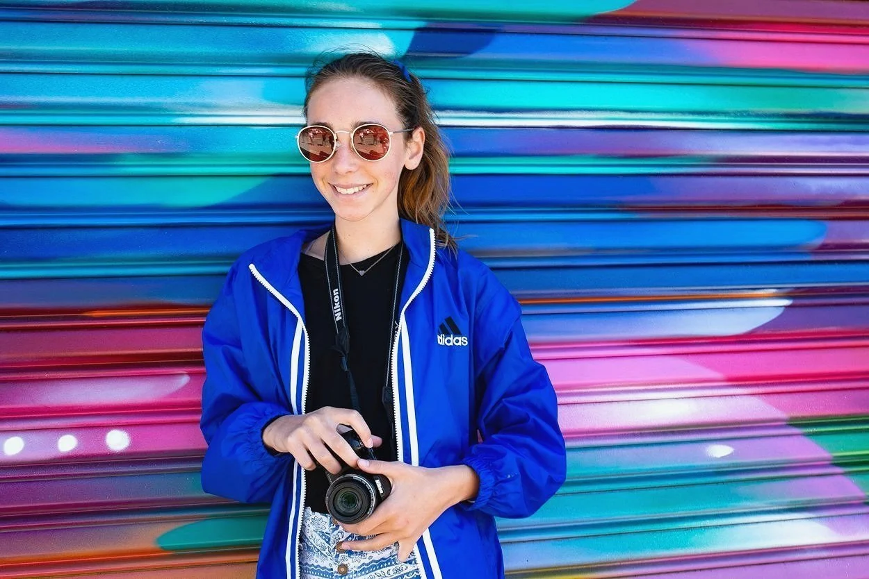 A student practicing photography during a photography class or workshop in the San Francisco Bay Area where teens and adults learn about photography.