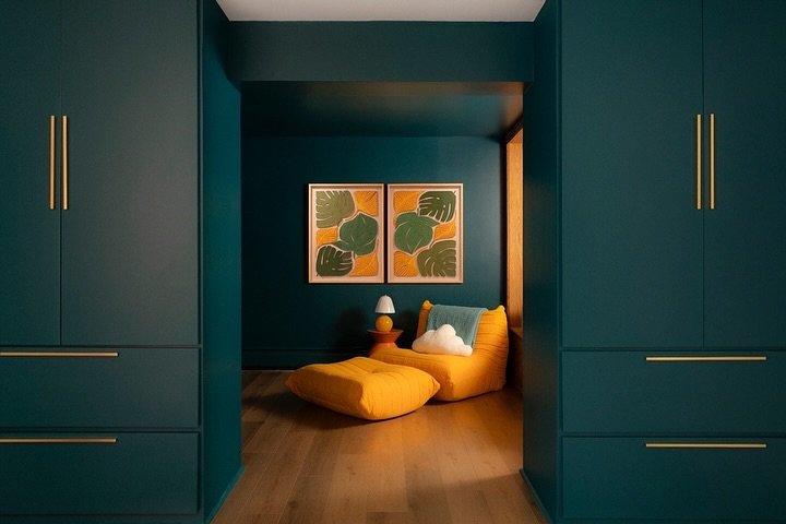 The perfect rec room/playroom/guest suite all in one. The designer, @interiorsinclusive, made a wall out of storage cabinets to separate the playroom and custom built in bed. The family uses it as a guest room but also as a cozy place to cuddle their