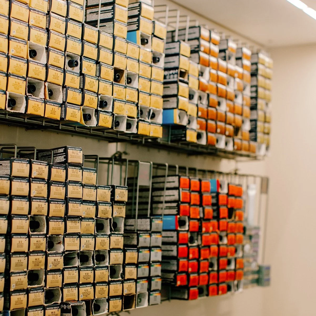 Shelf with organized boxes of Wella Professional hair color for stylists to use at B Parlor San Francisco Salon