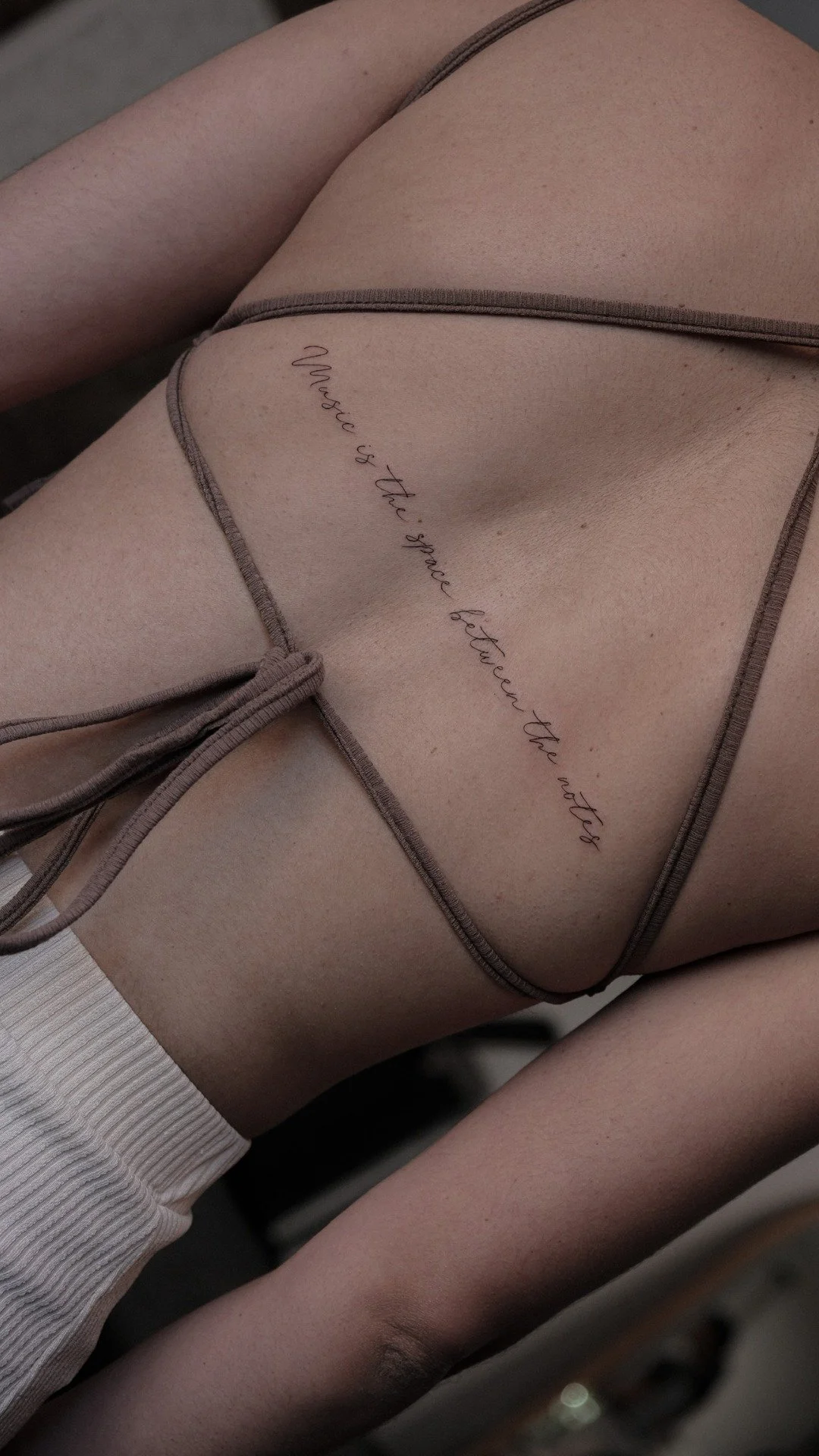 fine-line-script-rib-tattoo-soho-uplift.jpg