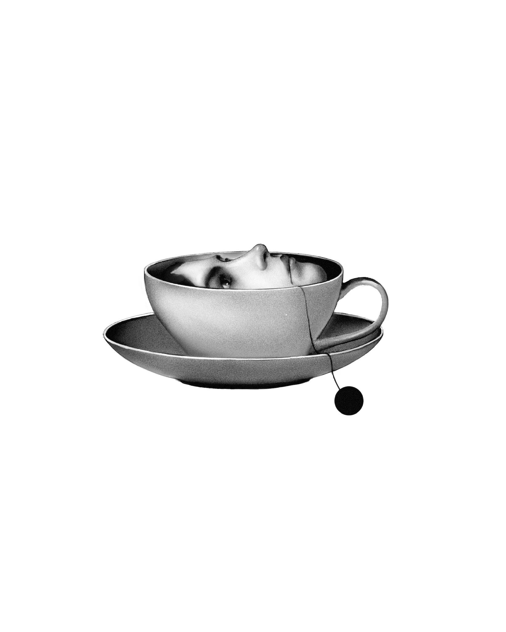 A black and white photo of a teacup and saucer with a human face reflected in the inner surface, and a tea bag hanging over the edge.
