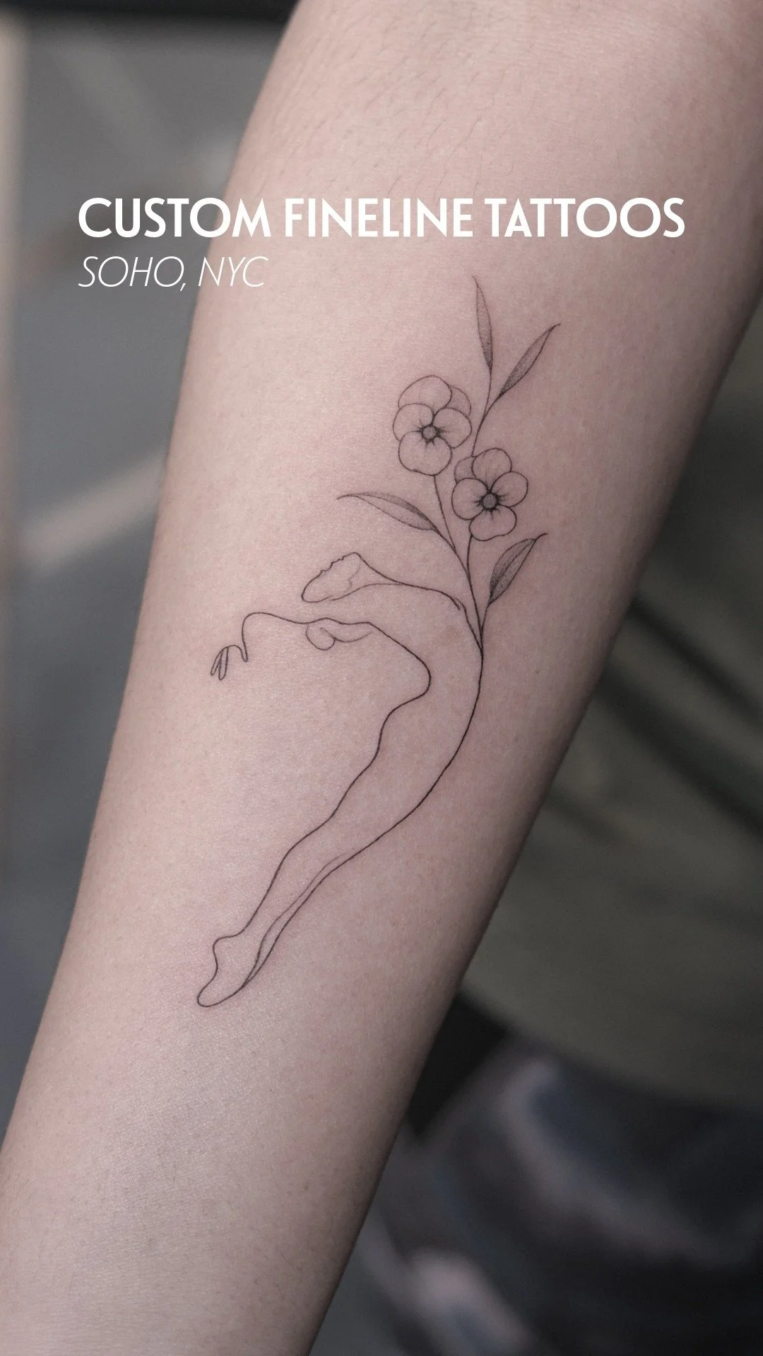 Minimal fine line floral figure tattoo on the arm at UPLIFT Tattoo & Piercing in SoHo NYC.