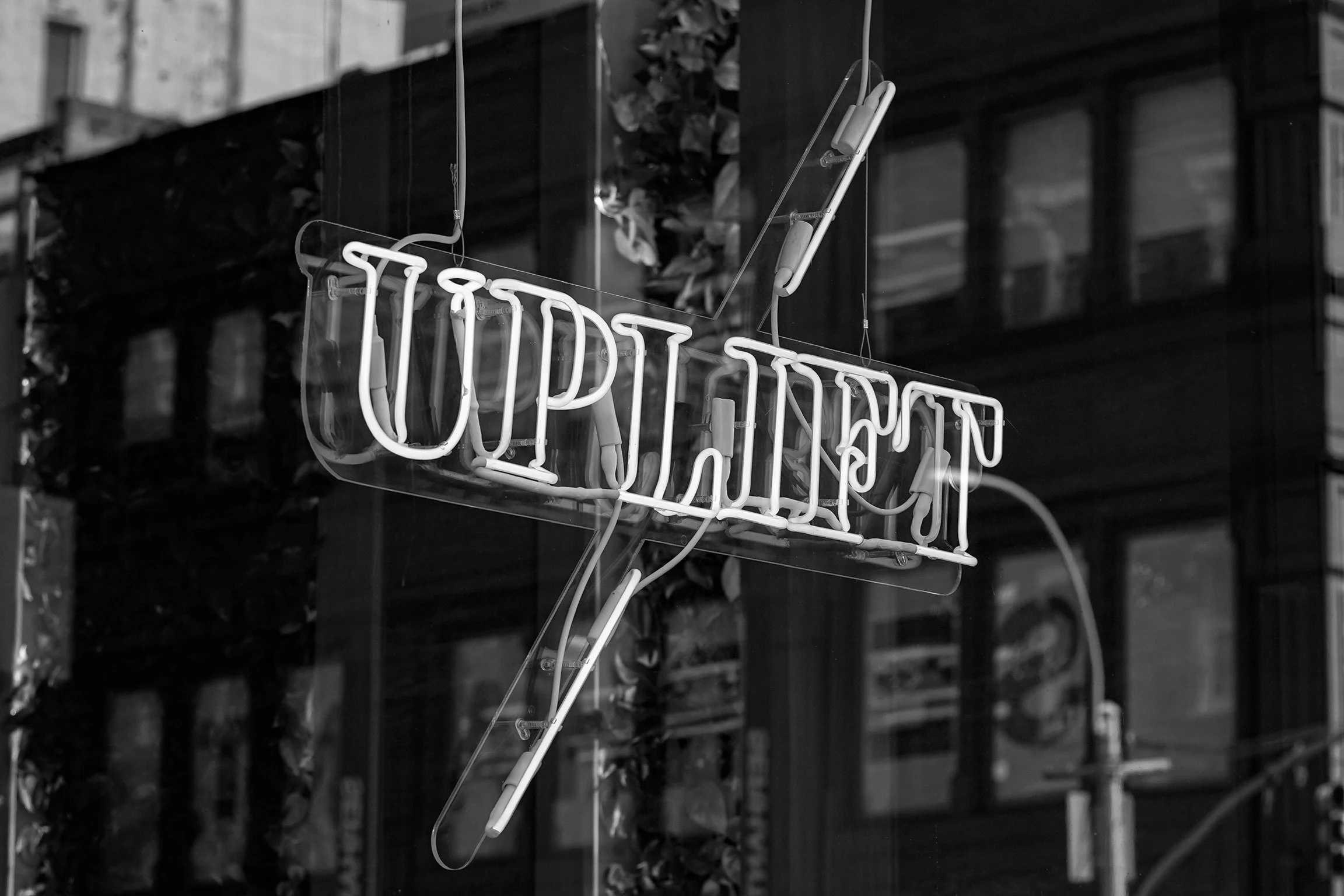 sign of uplift tattoo and piercing studio offering same day and walk in tattoo appointments