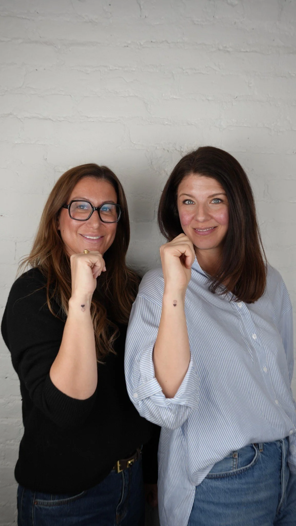 Matching heart tattoos on the wrist for tow best friends in New York City