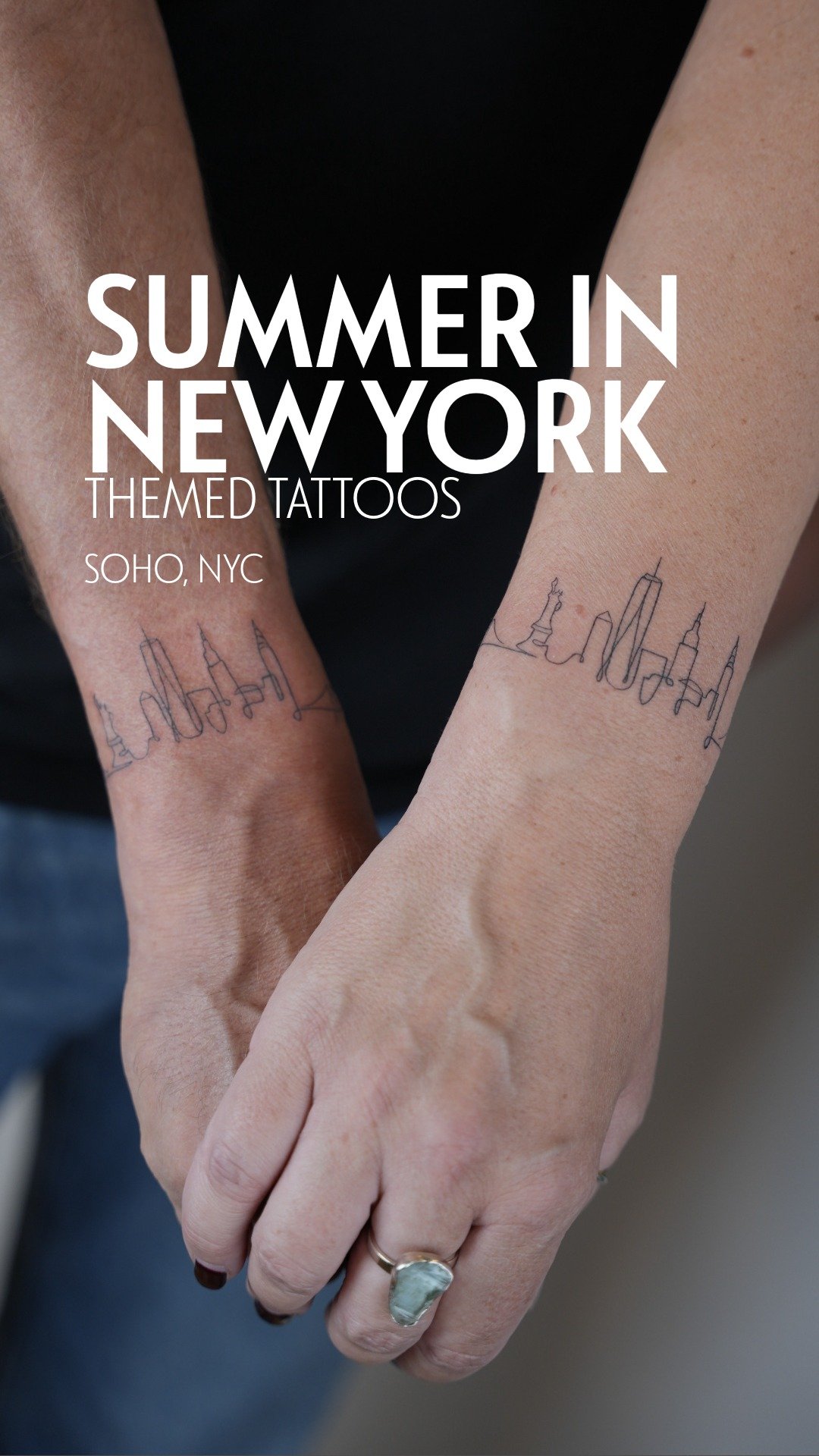 Close-up of two arms with matching New York City skyline tattoos in a continuous line design.