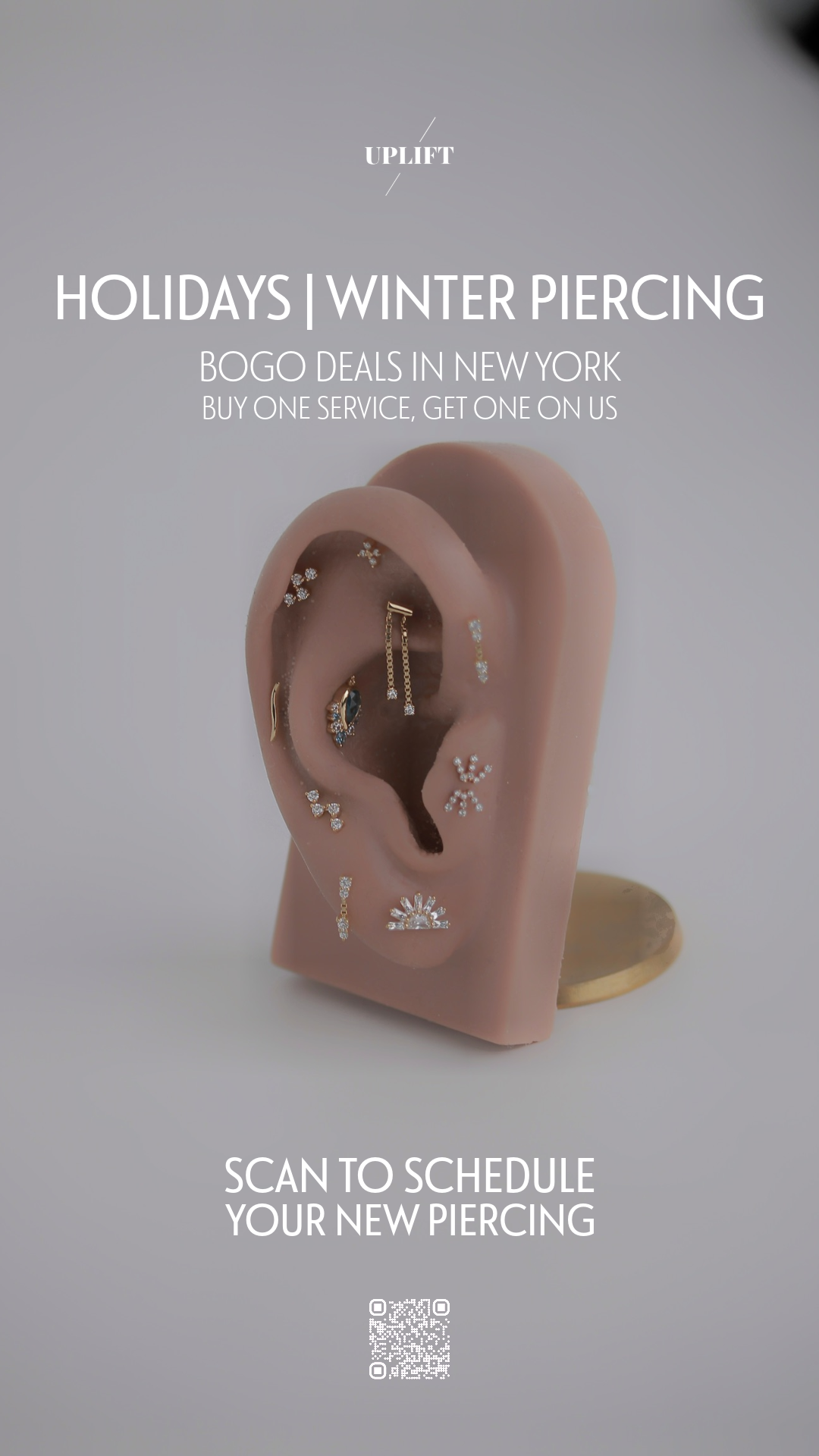 Advertisement for holiday and winter piercings featuring a realistic ear model with multiple earrings, and a QR code at the bottom for scheduling appointments.