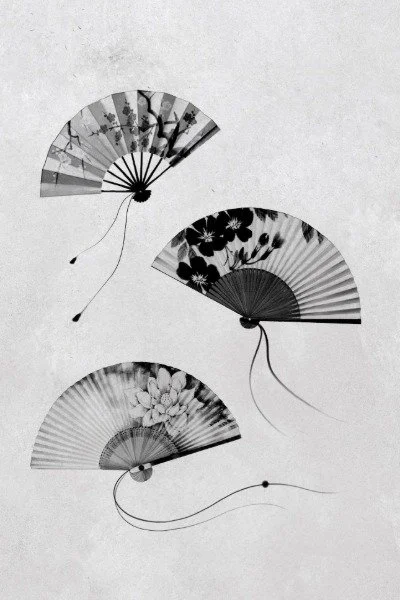 Three traditional Japanese folding fans with floral and nature designs, arranged on a light background.