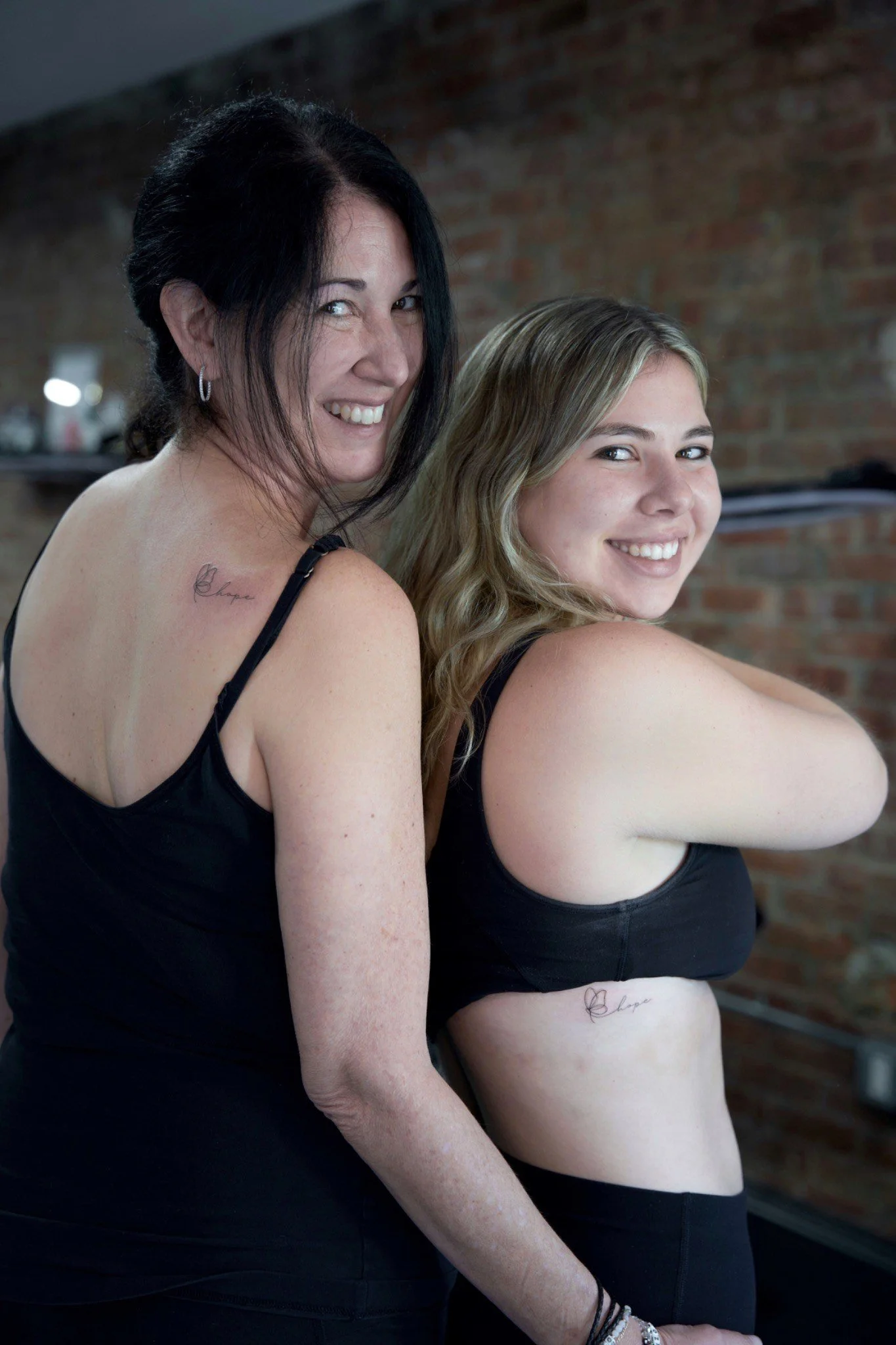 Mom and Daughter Matching Tattoos of butterfly in SoHO, New York